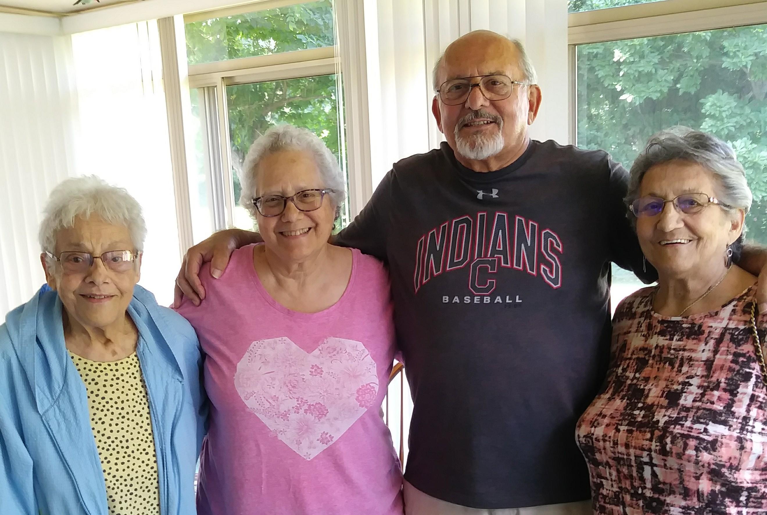 A group of older people posing for a photo