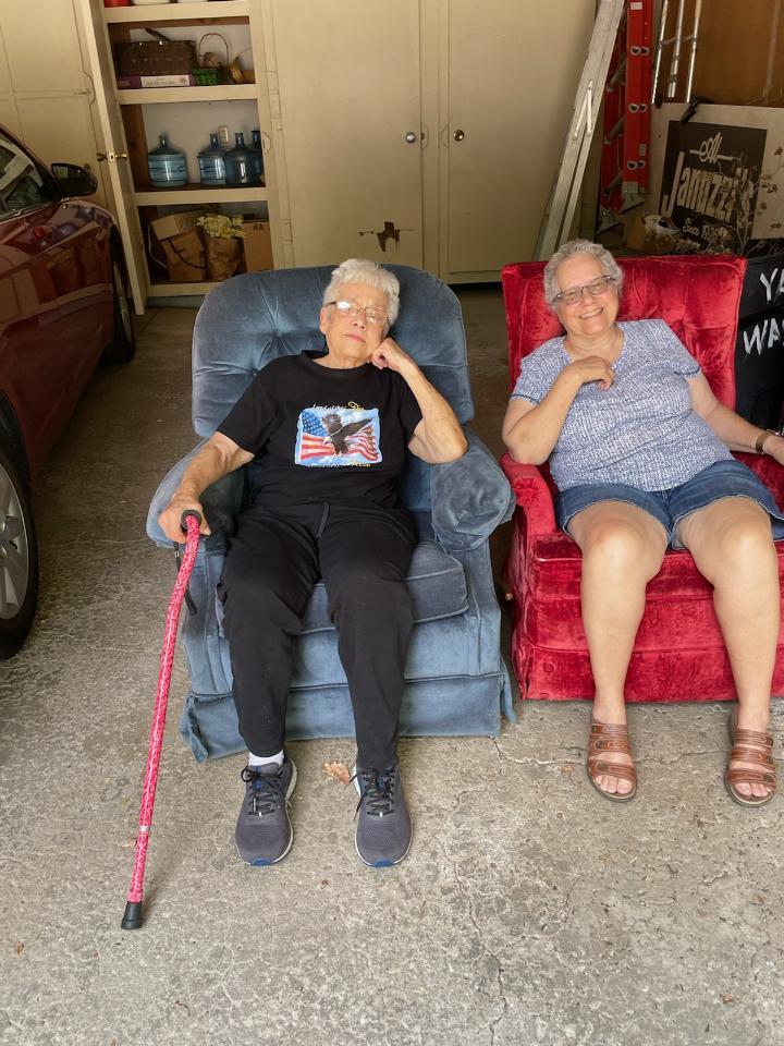 Two women sitting in chairs