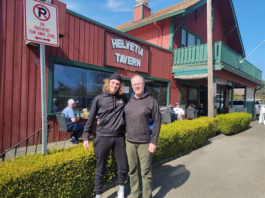 Two men standing in front of a building