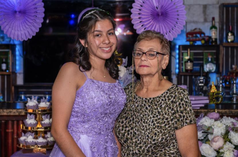 A woman and a woman posing for a picture