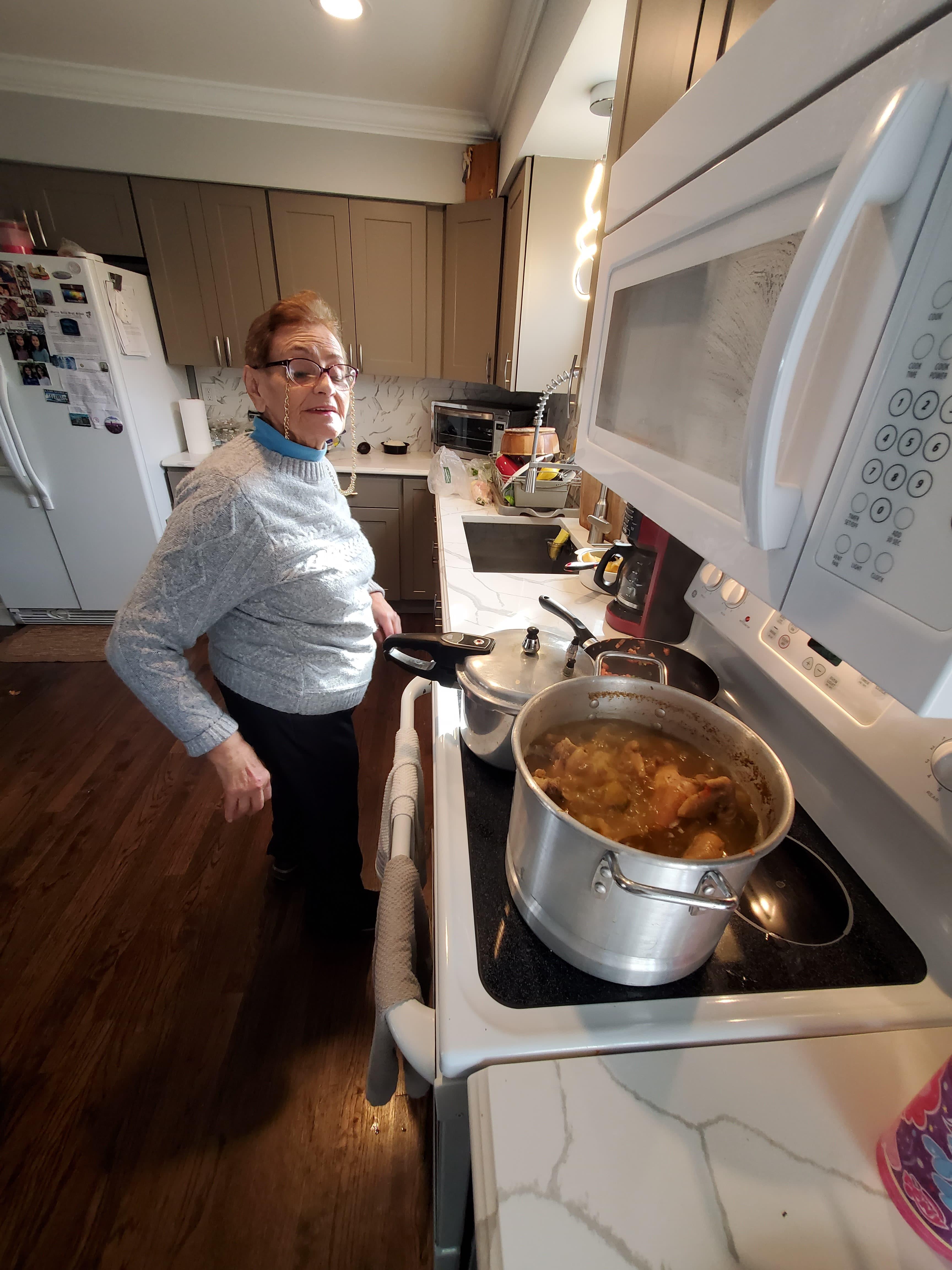 A woman standing in a kitchen