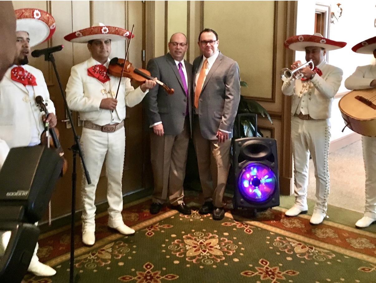 A group of men in suits playing instruments