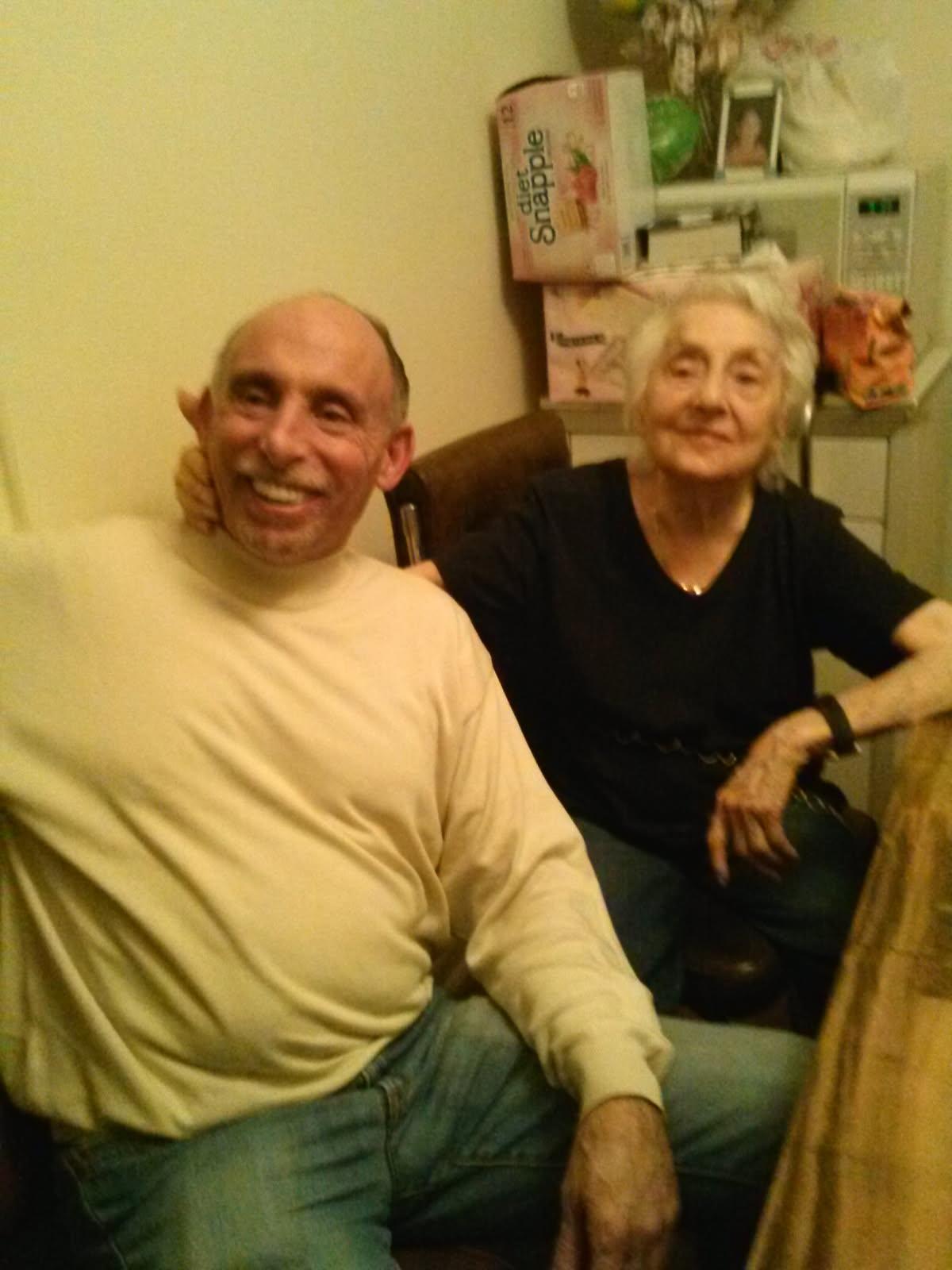 A man and woman sitting on a couch