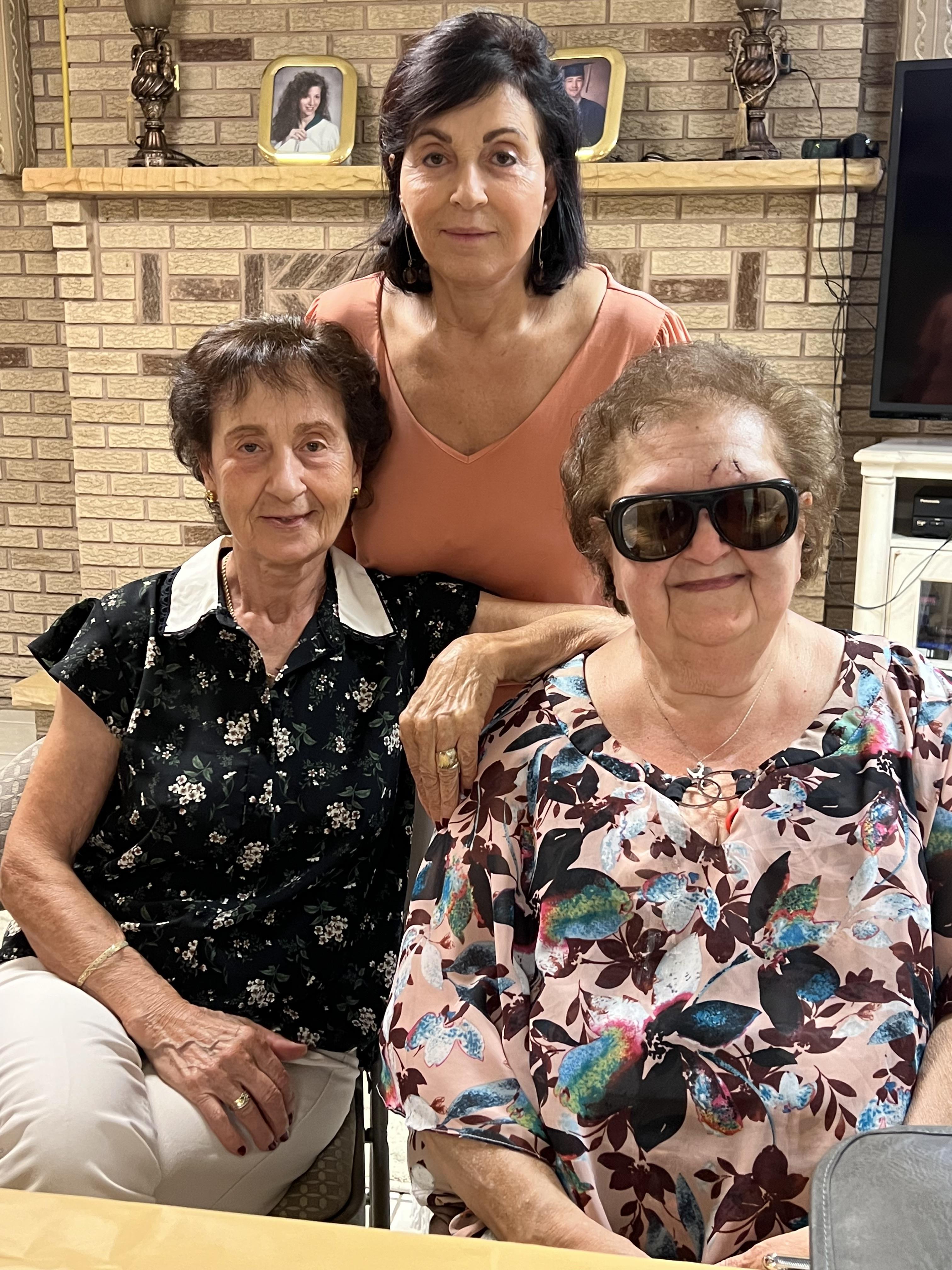 A group of women sitting in a chair