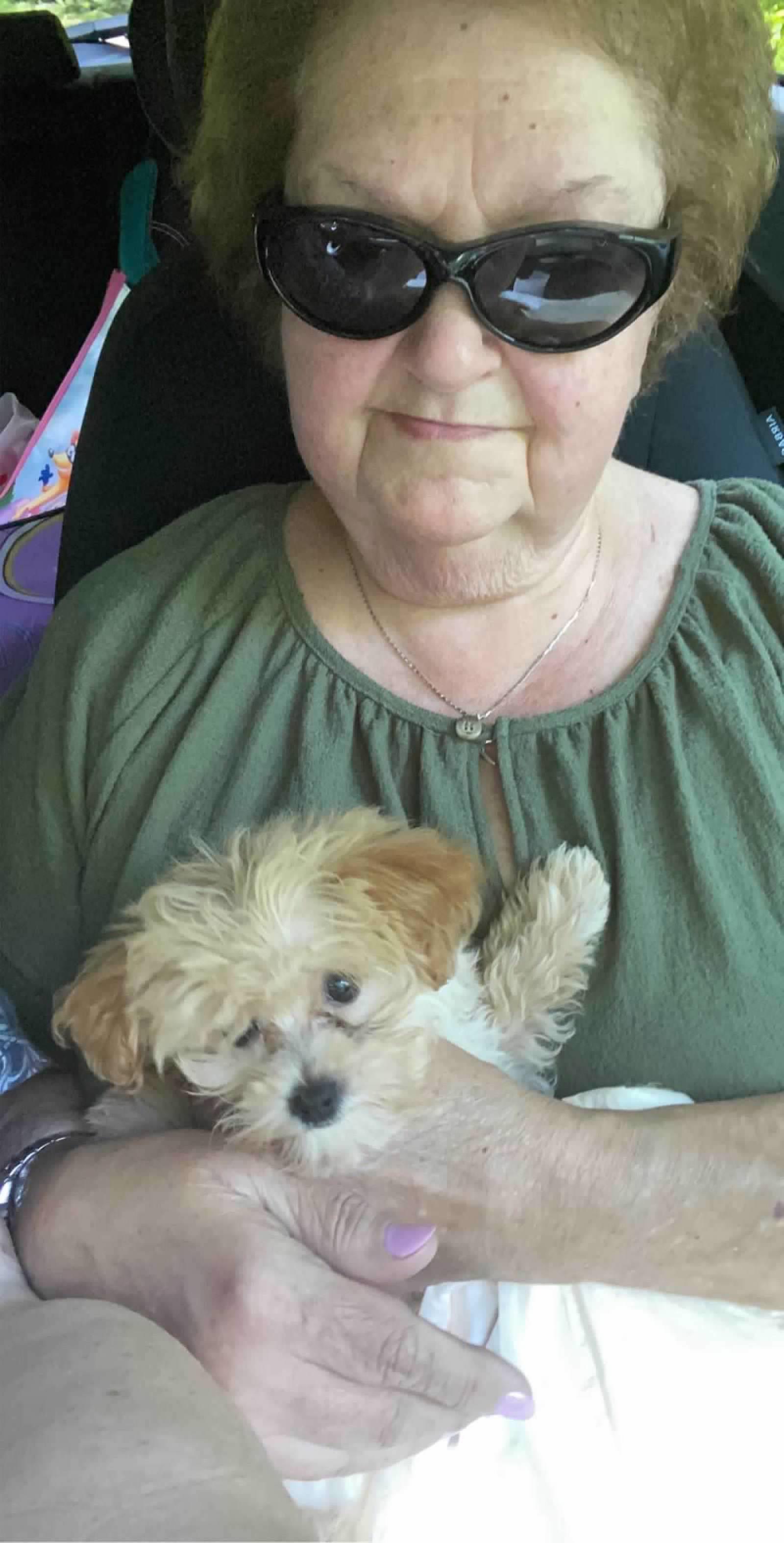 A woman holding a dog