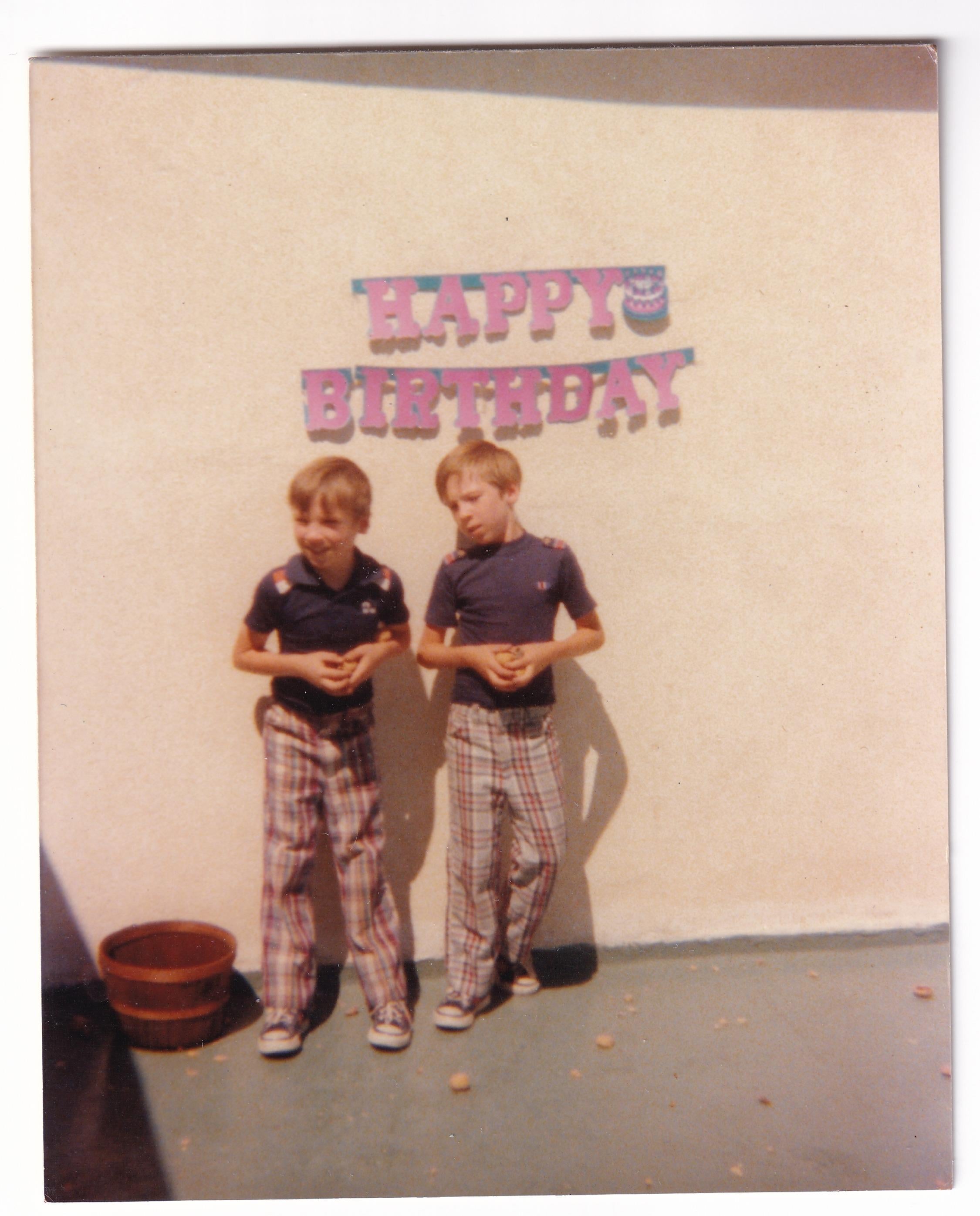 Two boys standing next to each other