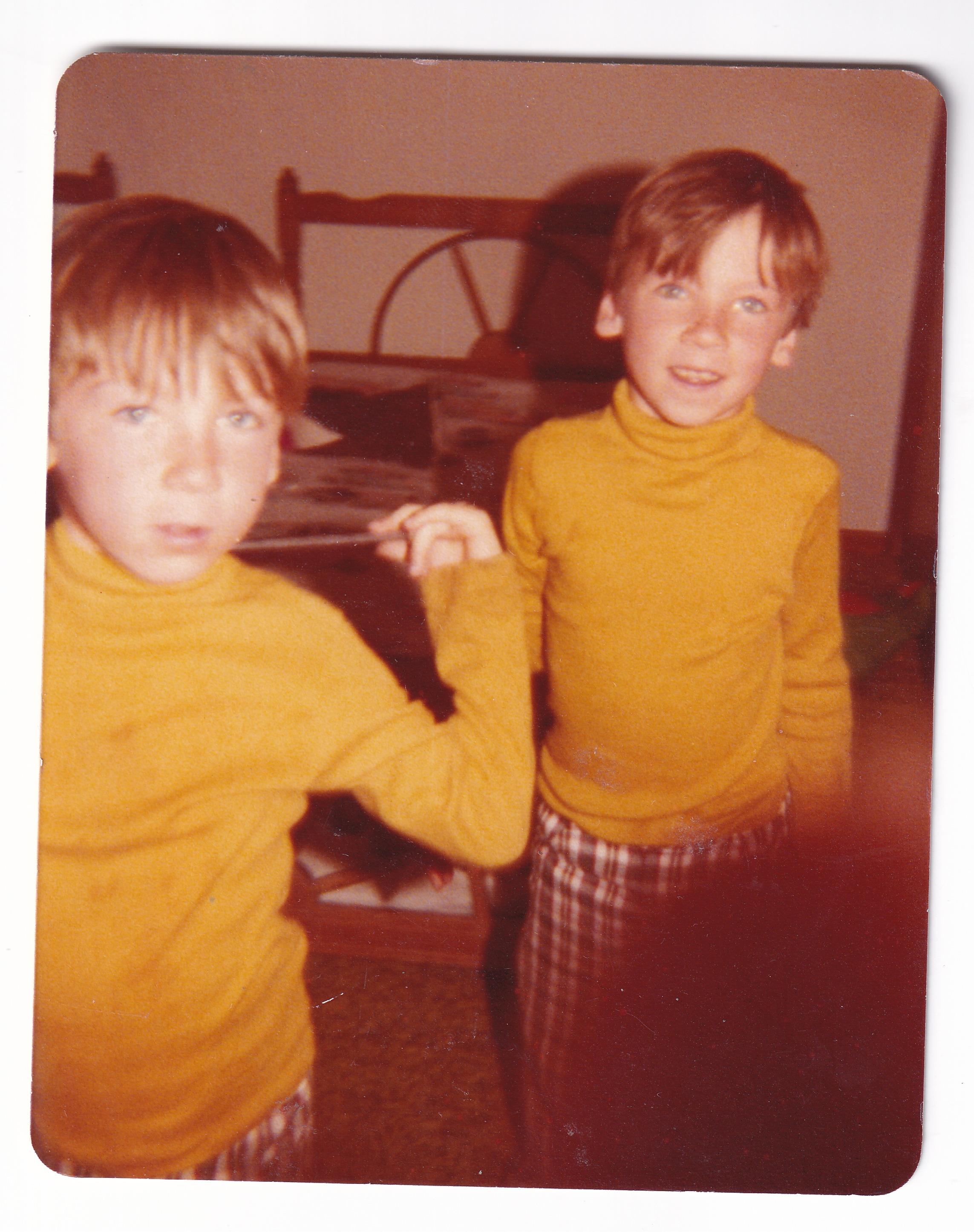 A couple of boys in yellow shirts