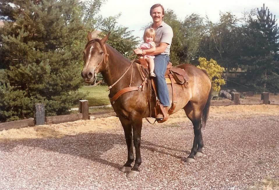 A man and child on a horse