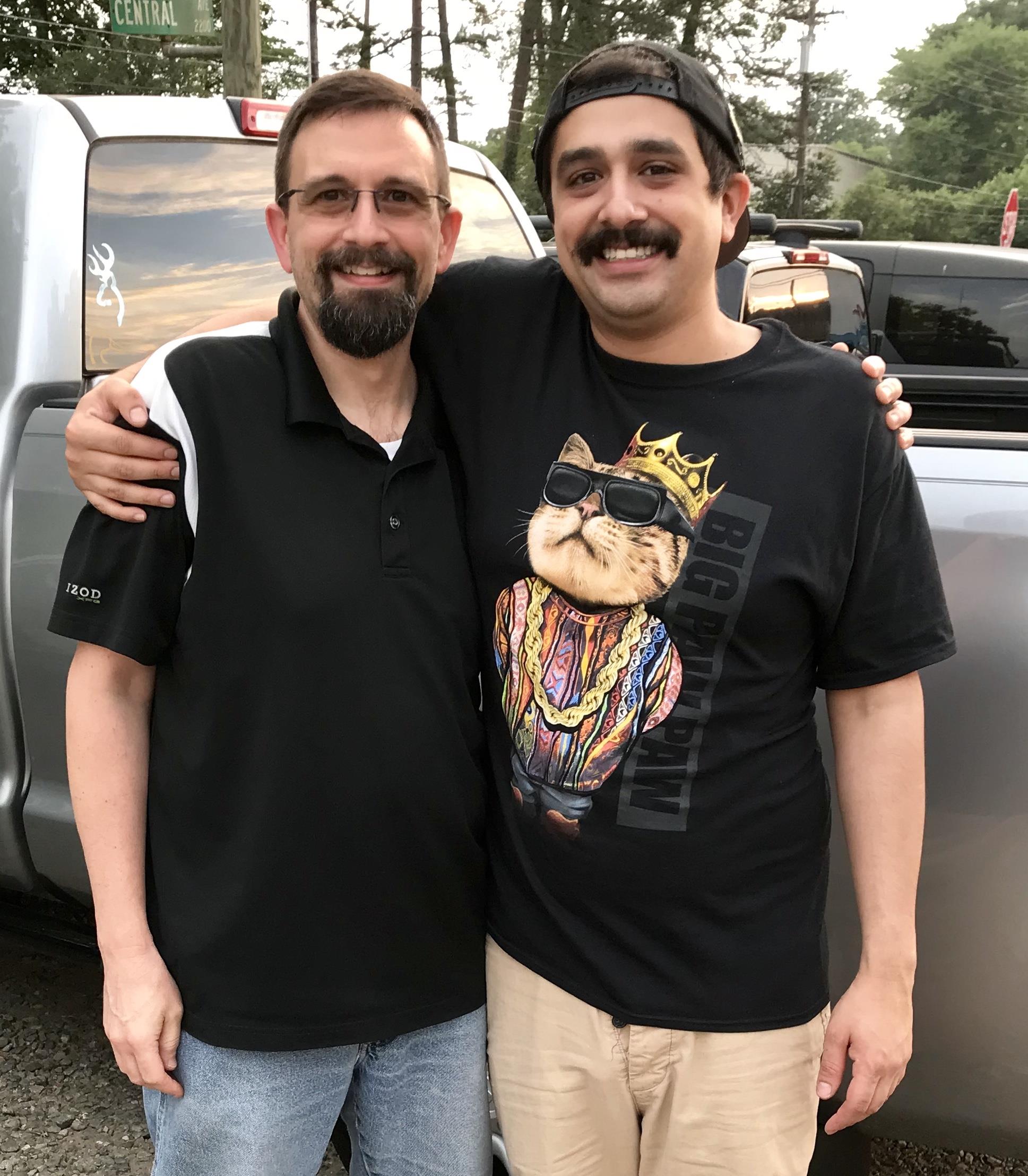 Two men standing next to each other