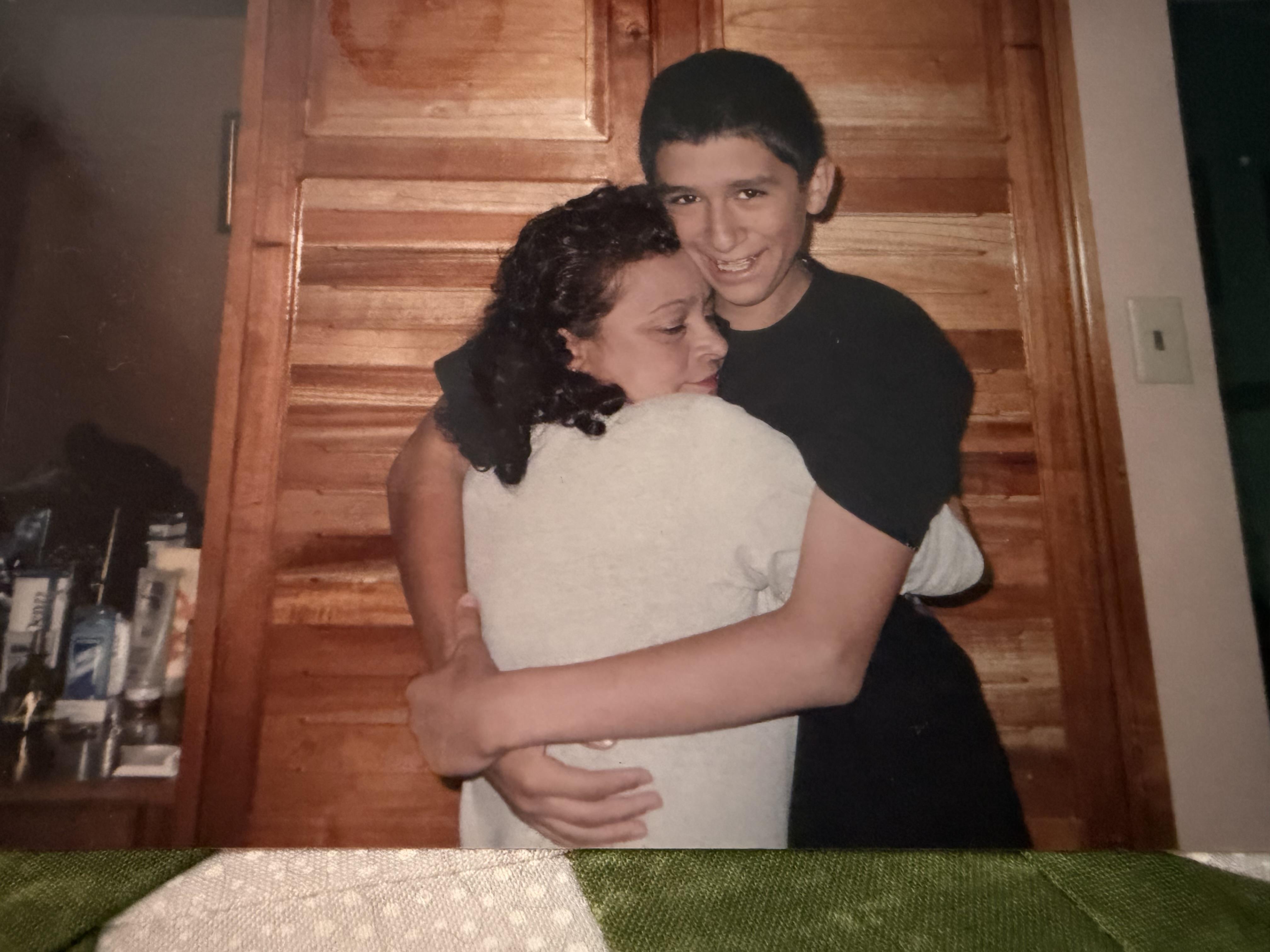 A boy and girl hugging