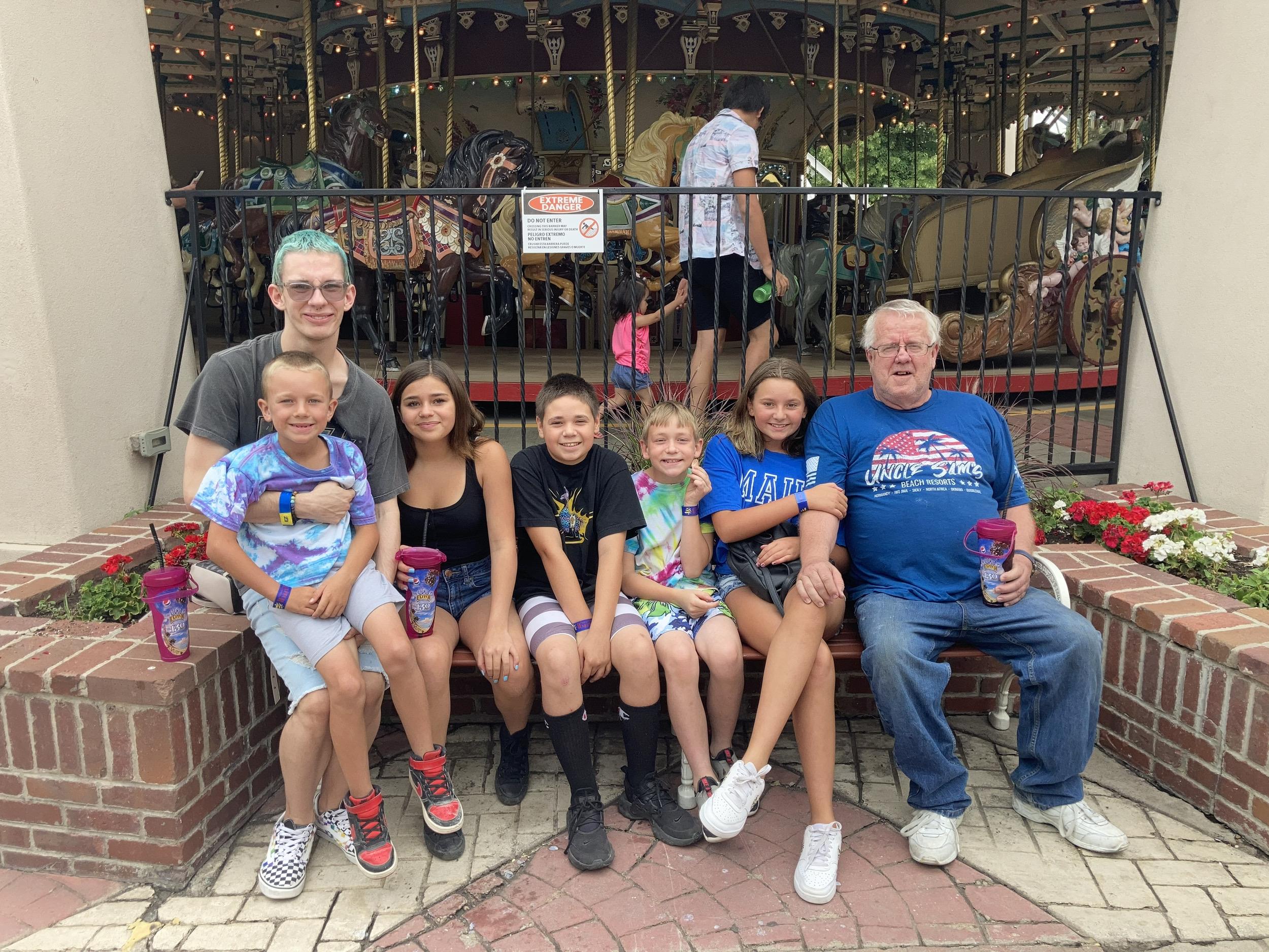 A group of people sitting on a bench