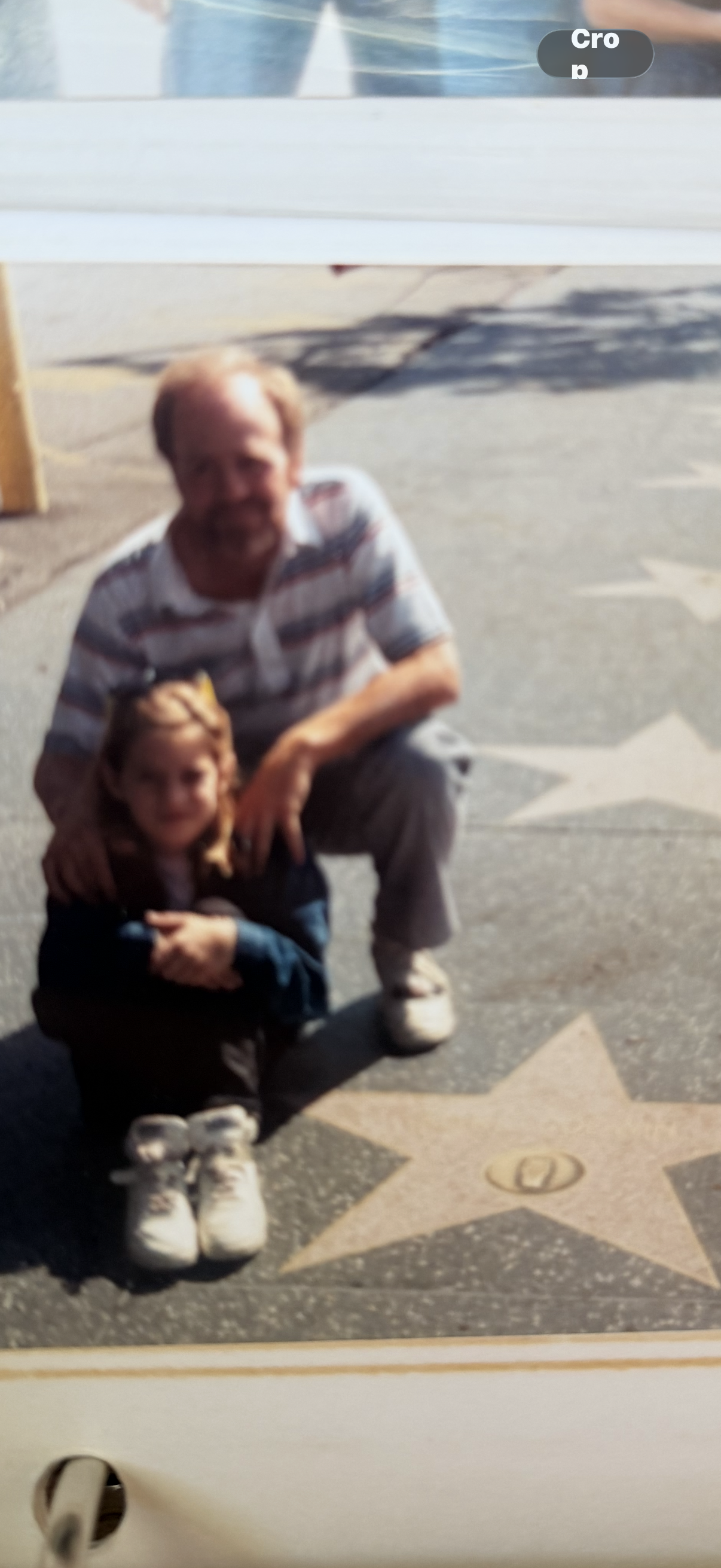 A man and girl posing for a picture