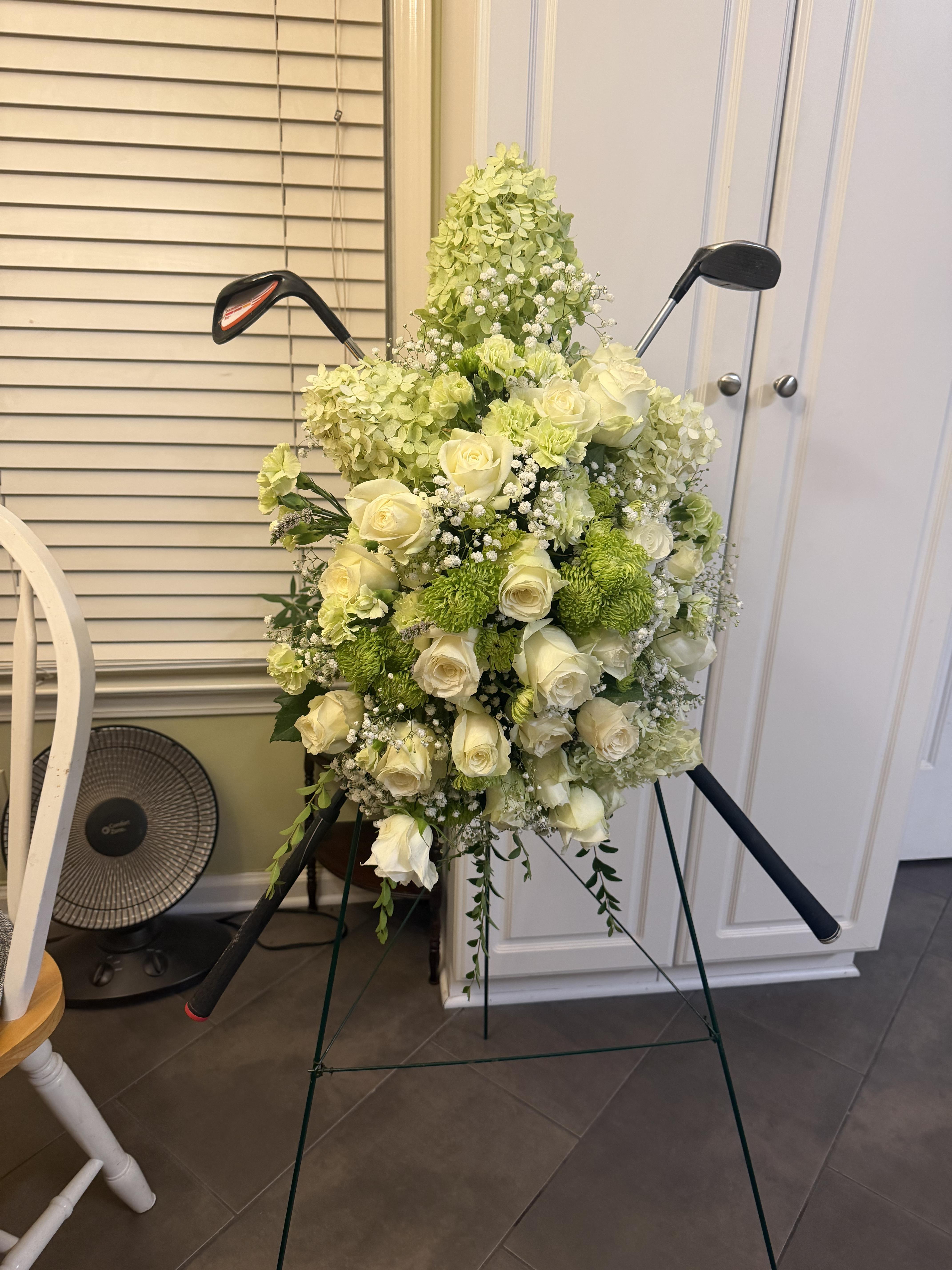 A bouquet of flowers on a stand