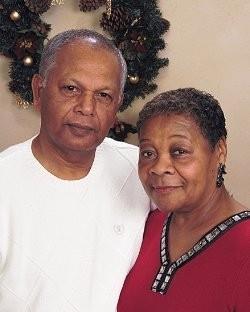 A man and woman posing for a picture