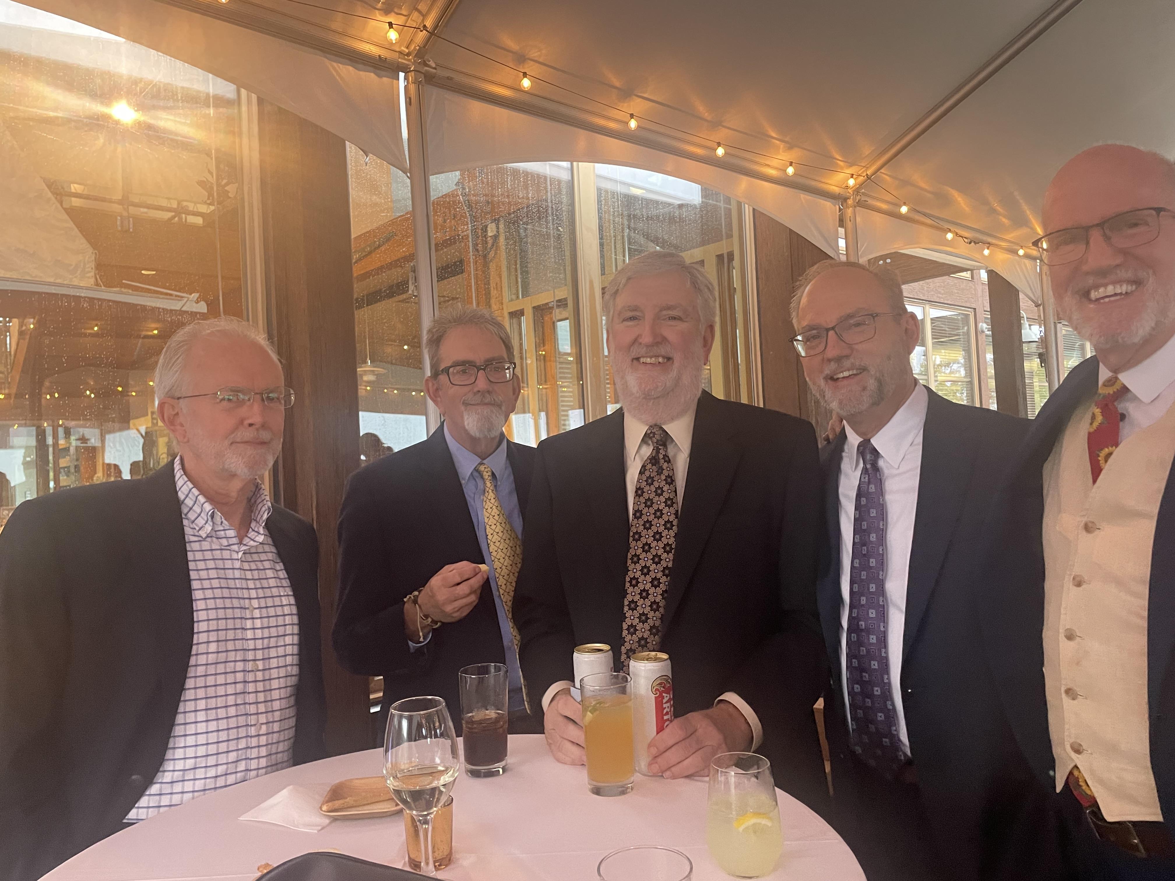 A group of men in suits and ties