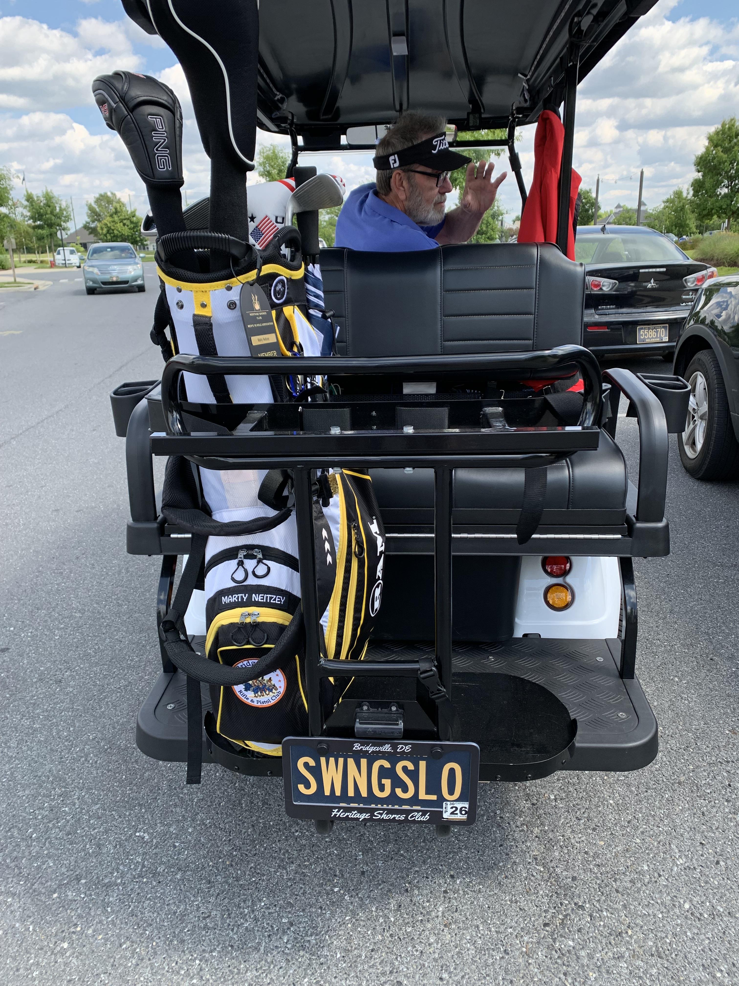 A man in a golf cart