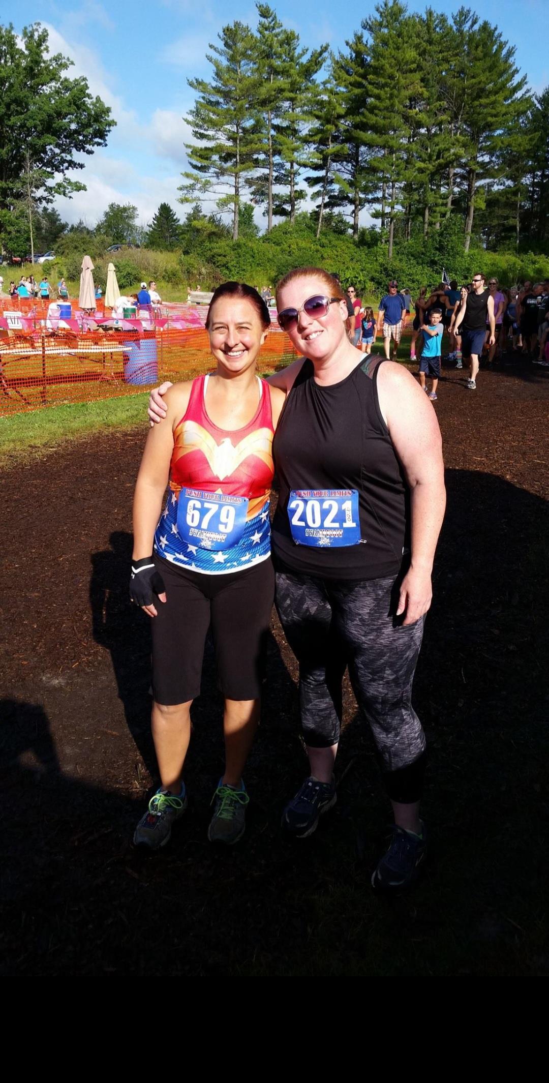 Two women standing together smiling