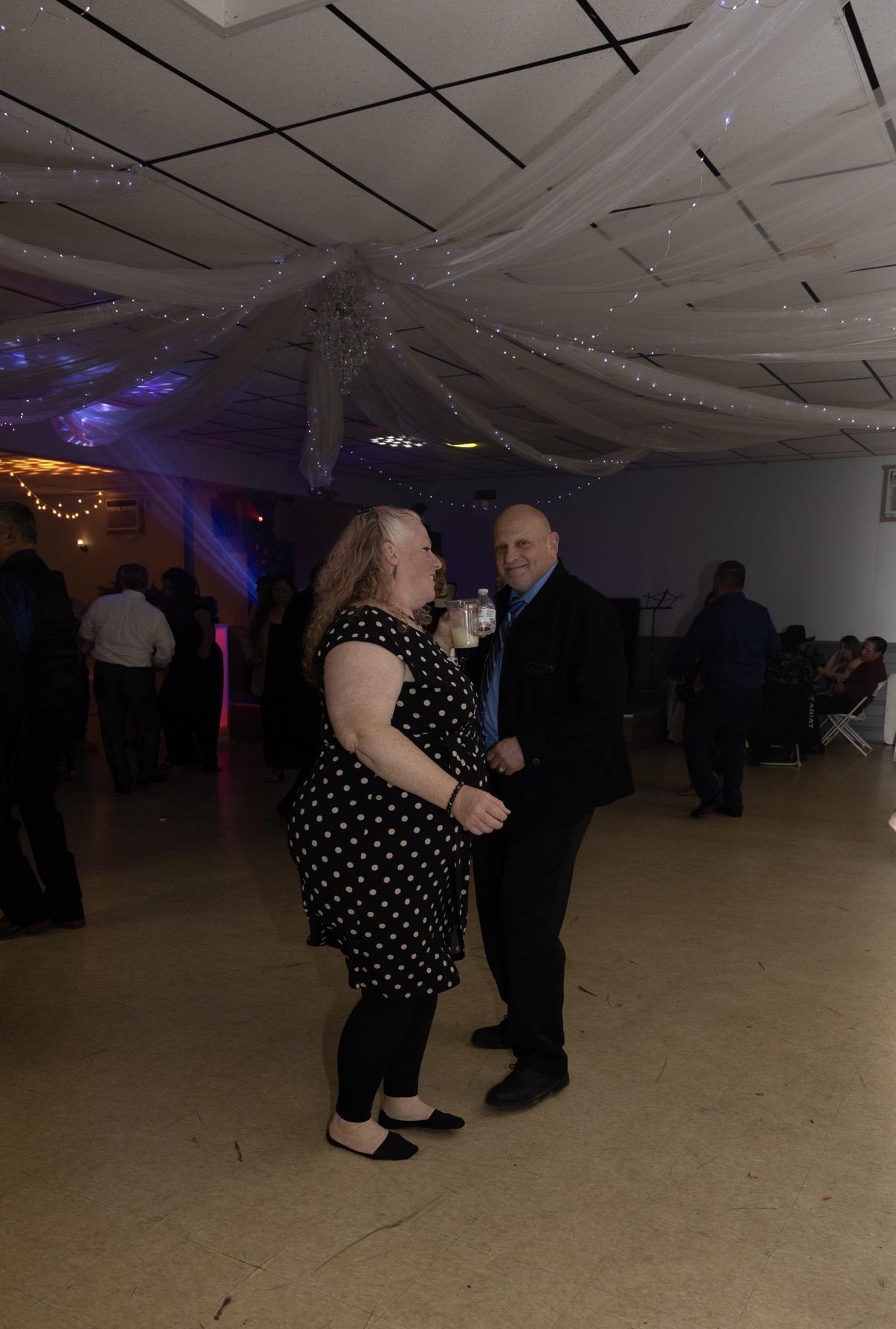 A man and woman dancing in a room