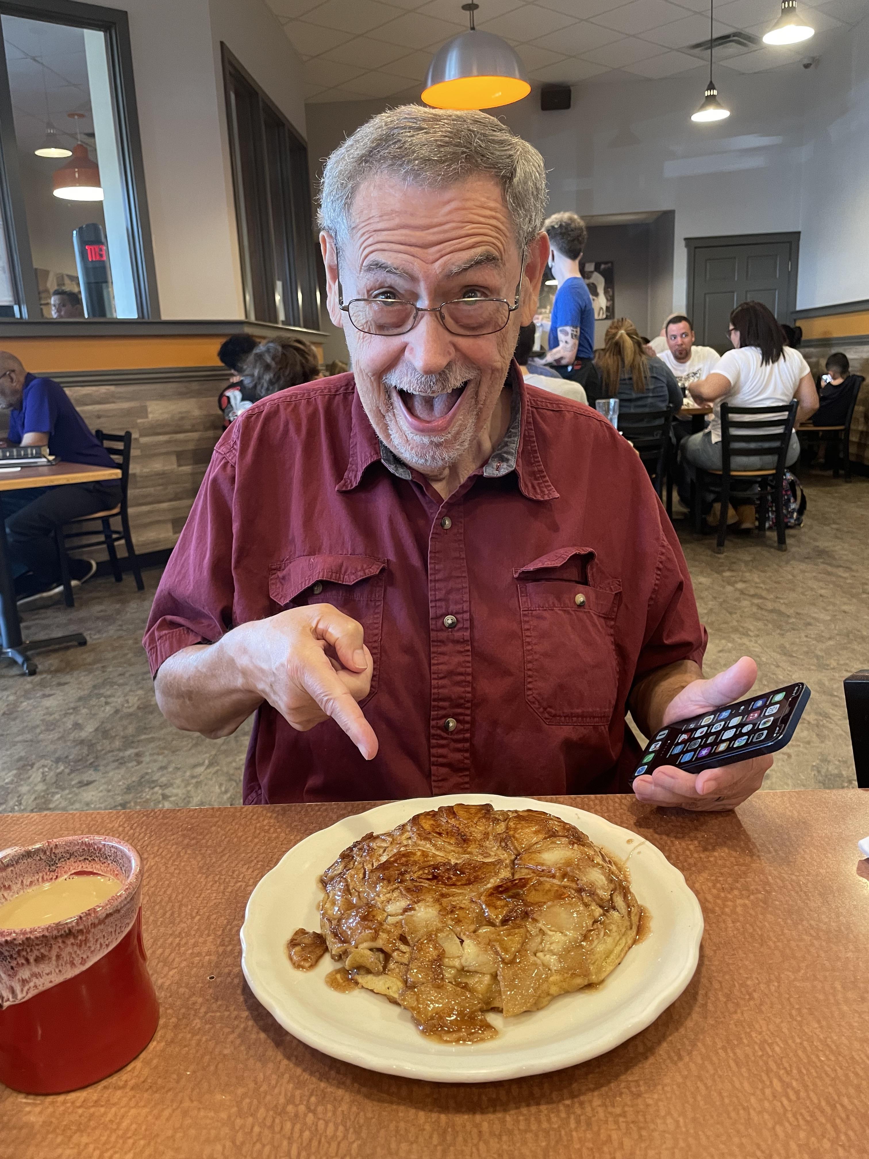 A man pointing at a plate of food