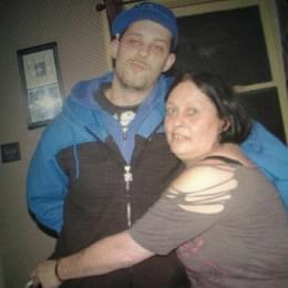 A man and woman posing for a picture