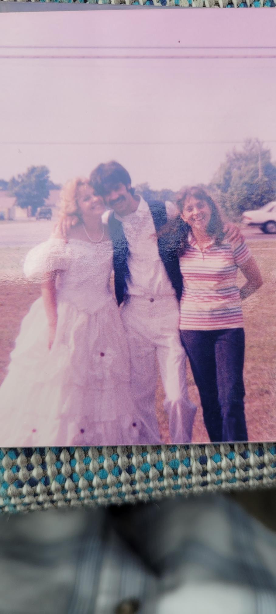 A man and woman in white dresses
