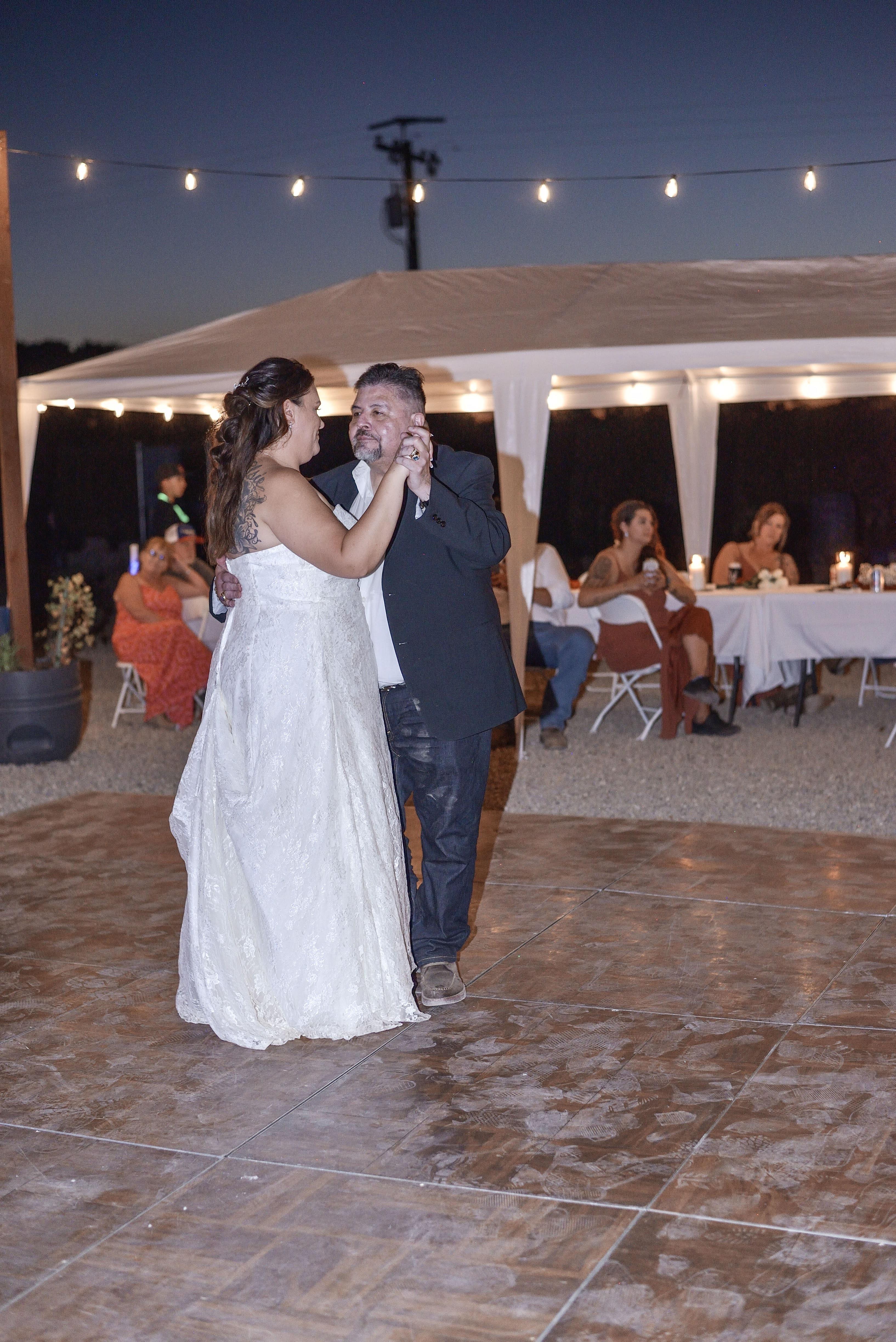 A man and woman dancing at a wedding