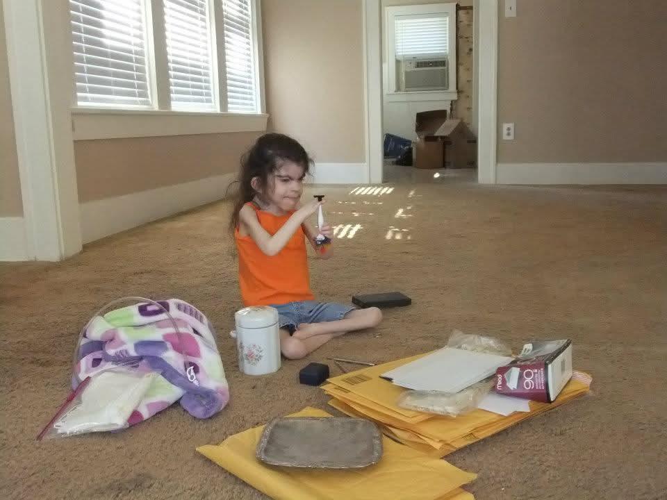 A girl sitting on the floor