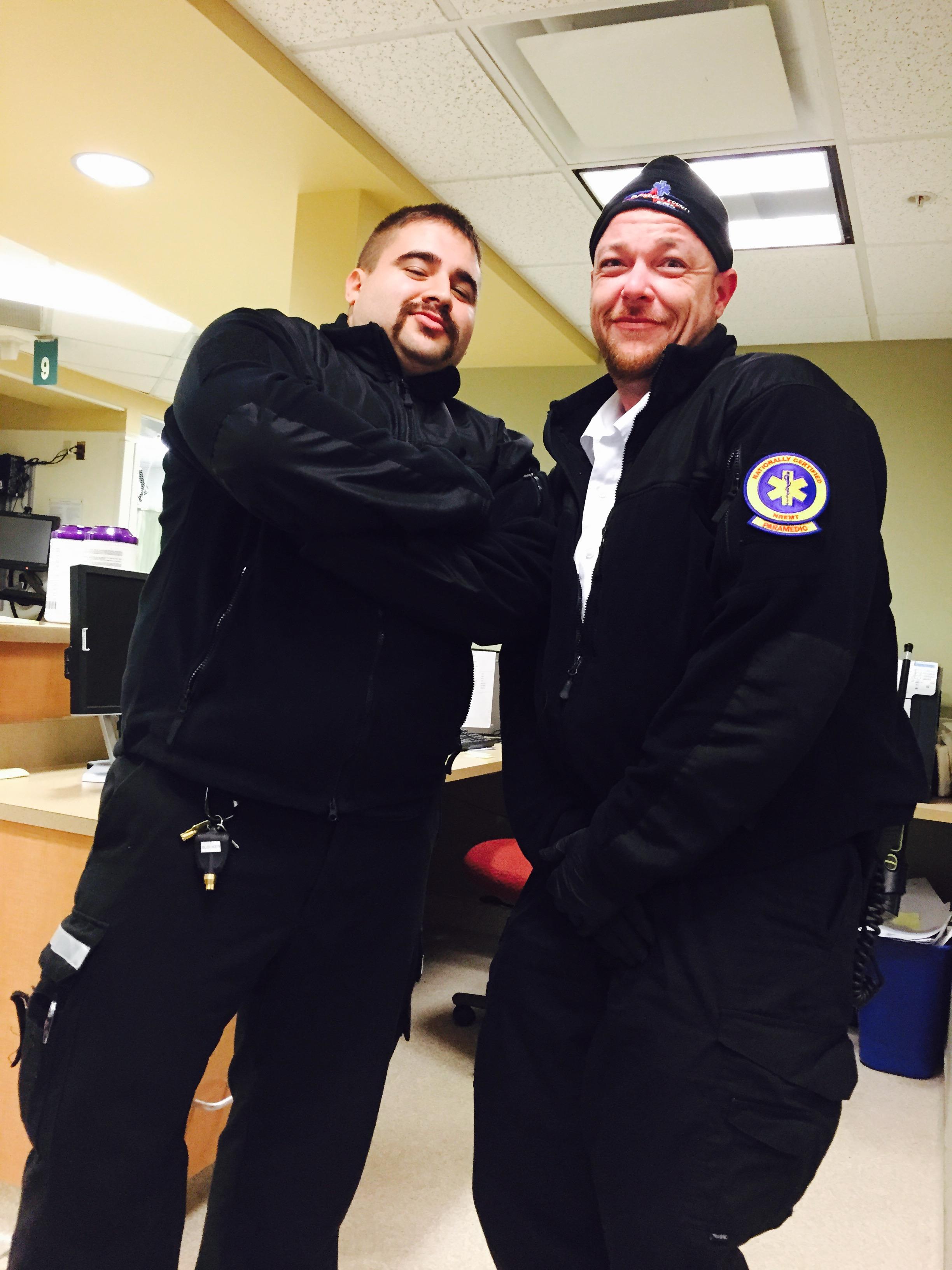 Two men in black uniforms