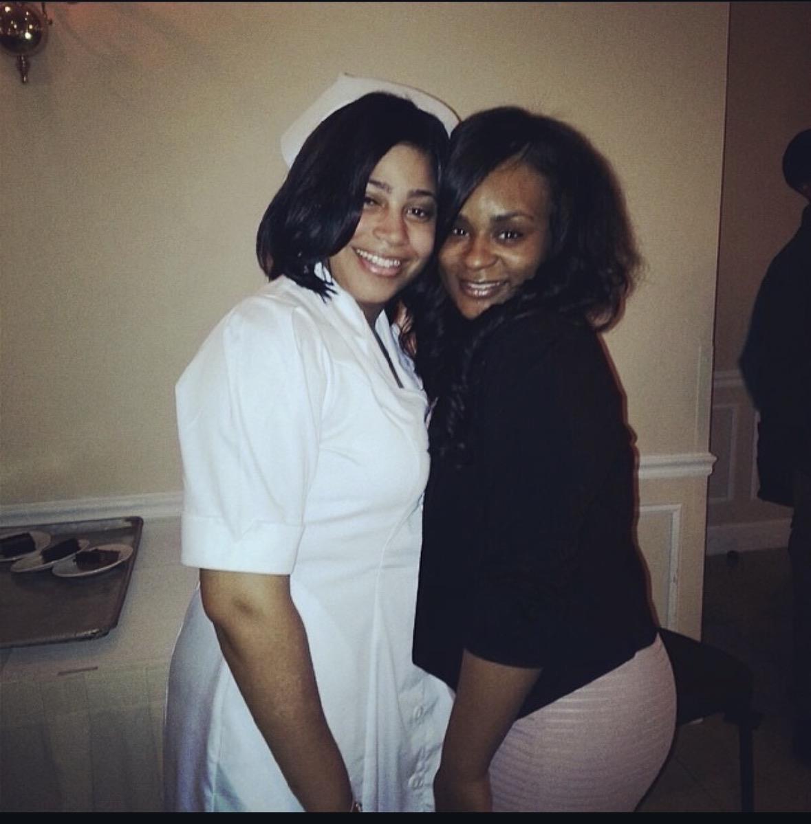 A couple of women posing for a picture