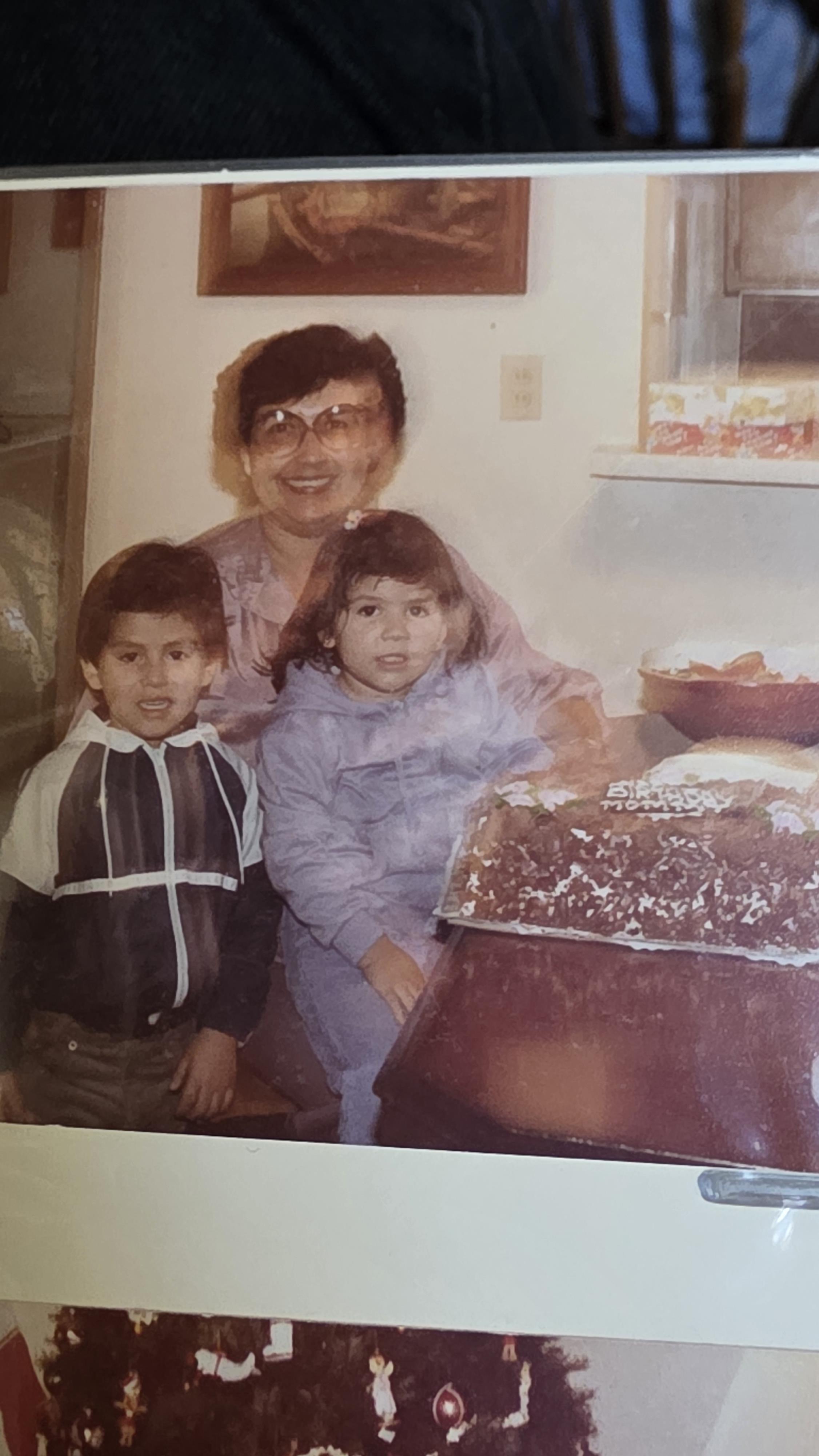 A woman and two children posing for a picture