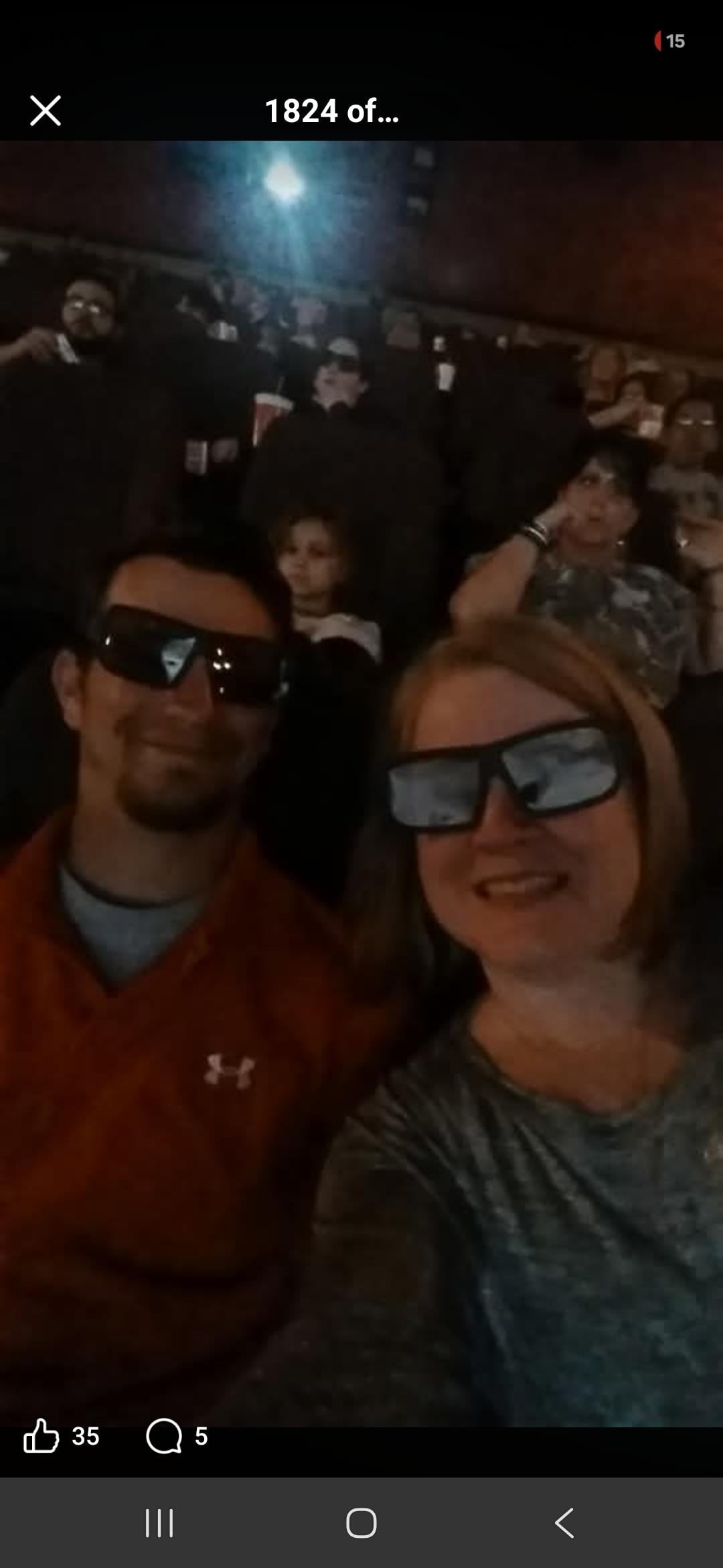 A man and woman wearing sunglasses