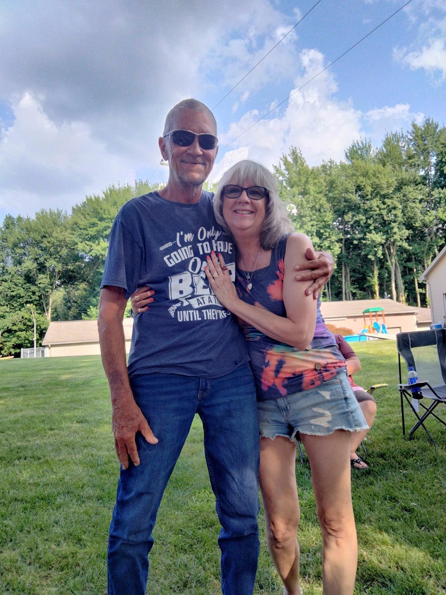 A man and woman posing for a picture