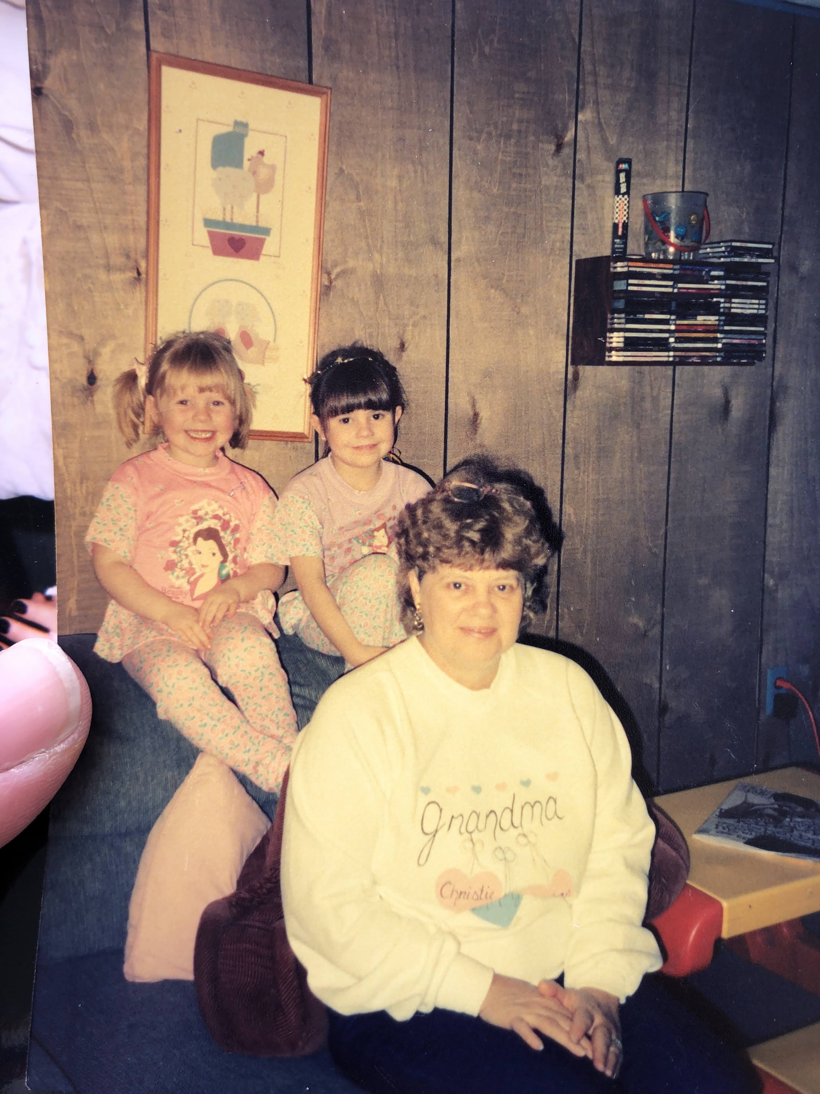 A woman and two girls posing for a picture