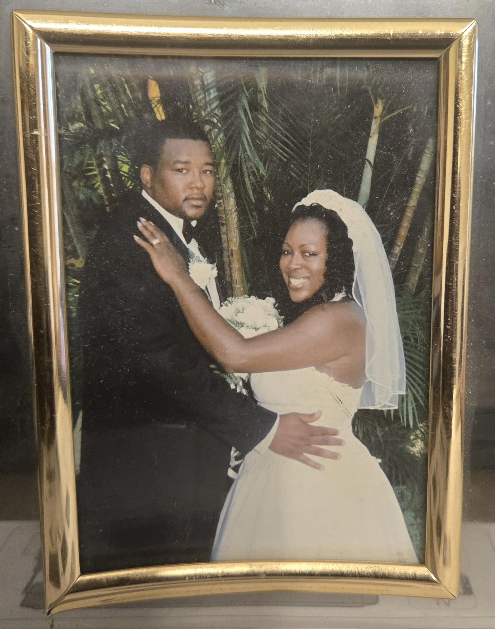 A man and woman in a picture frame