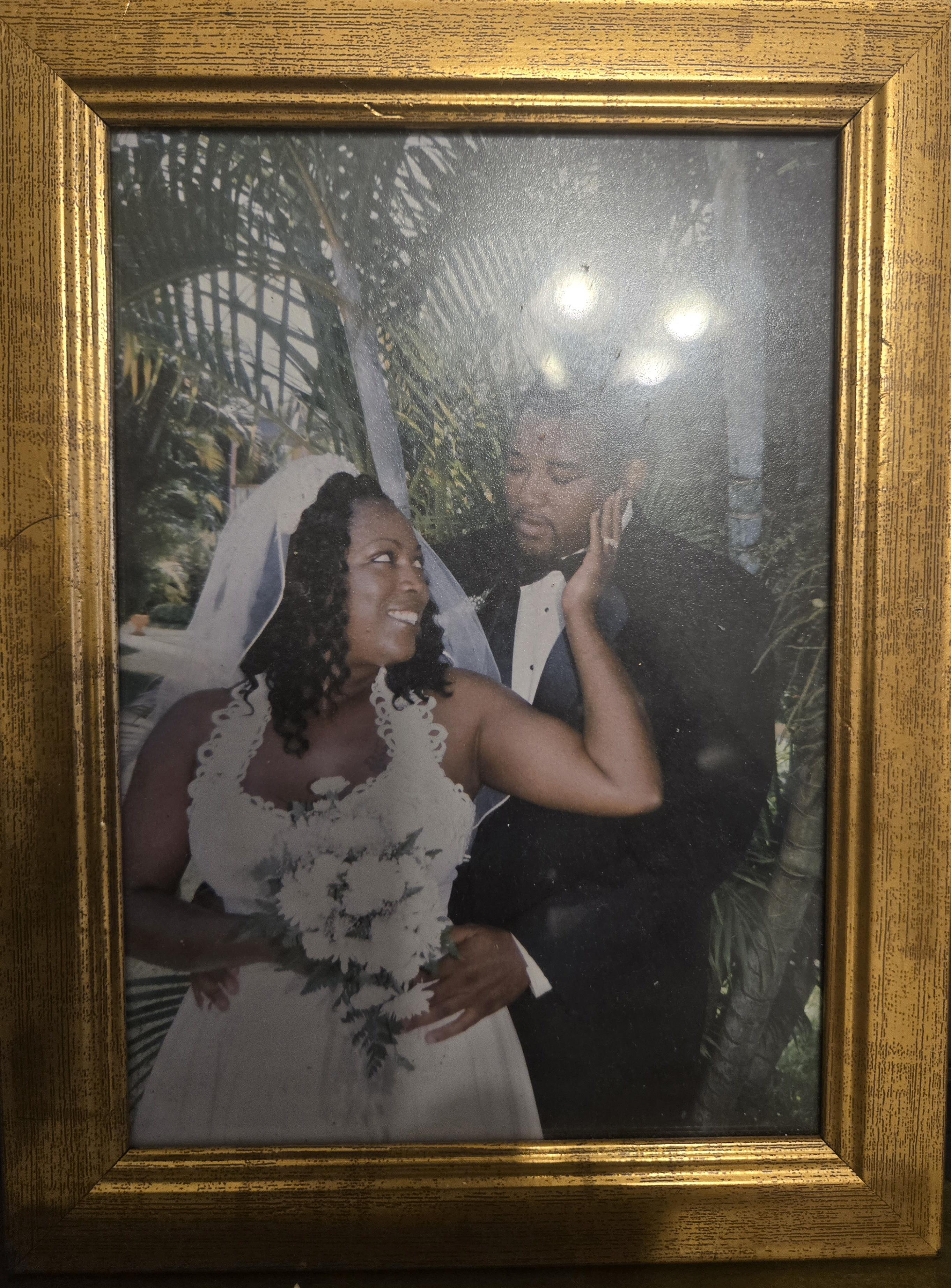 A framed picture of a bride and groom