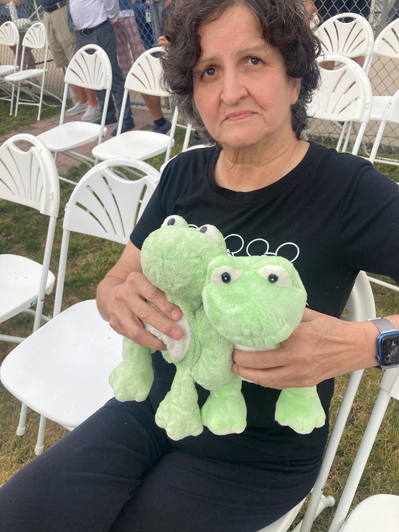 A woman holding a stuffed animal