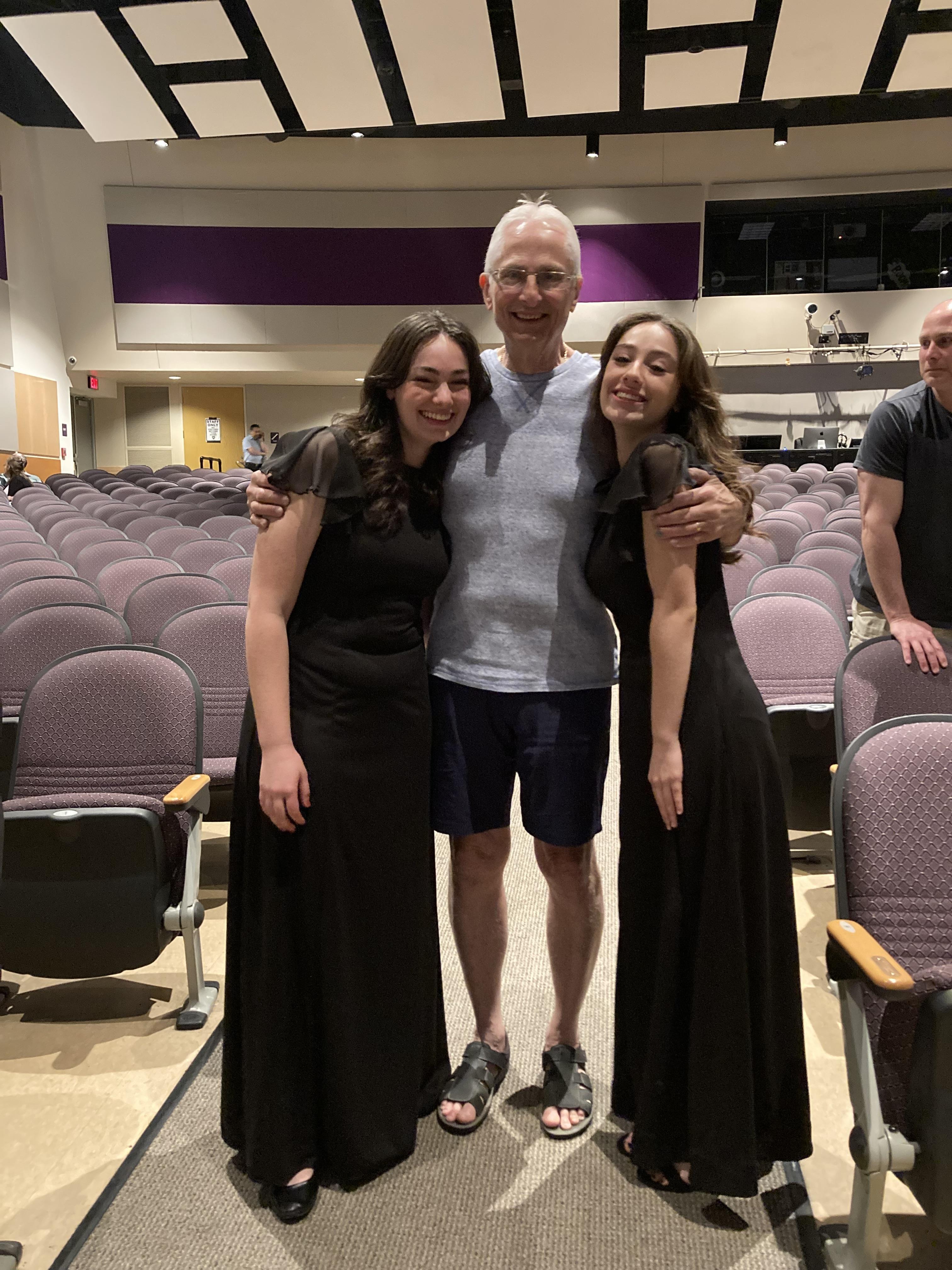 A man and two women posing for a picture