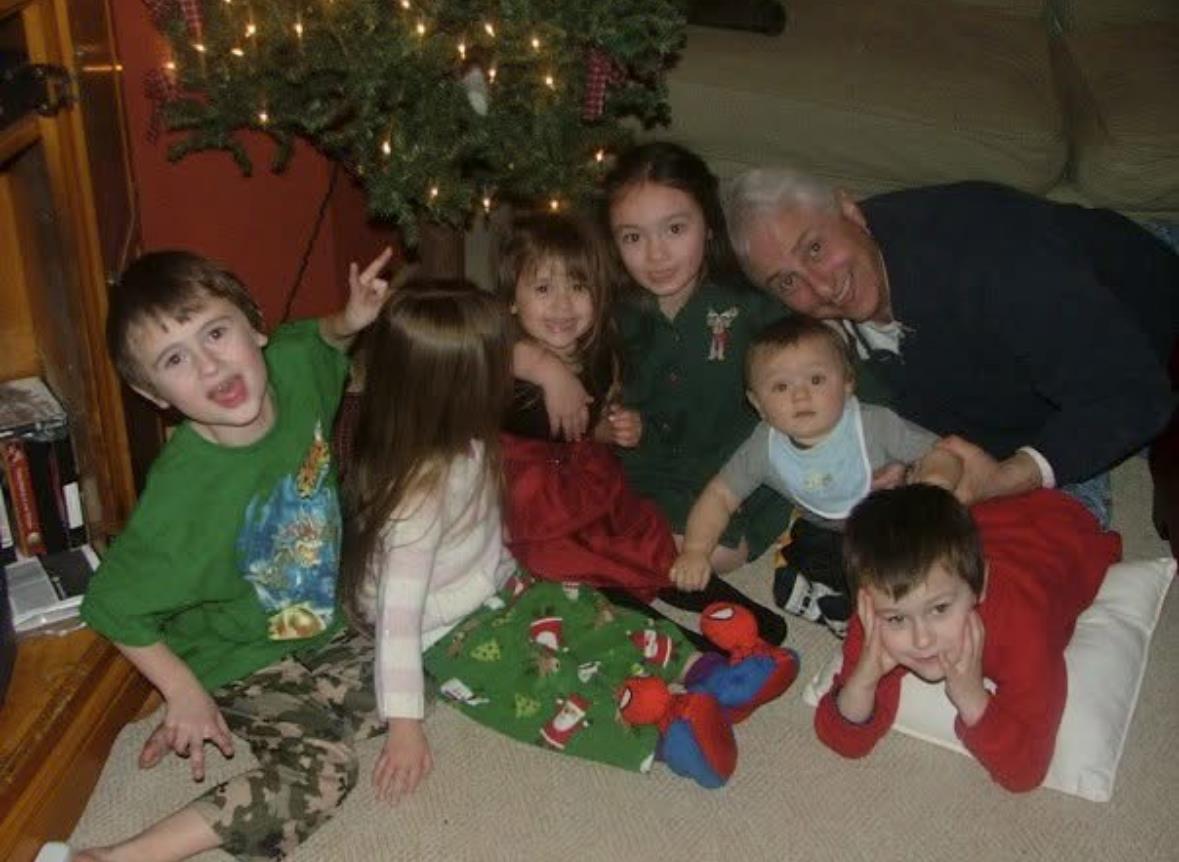 A group of children sitting on the floor