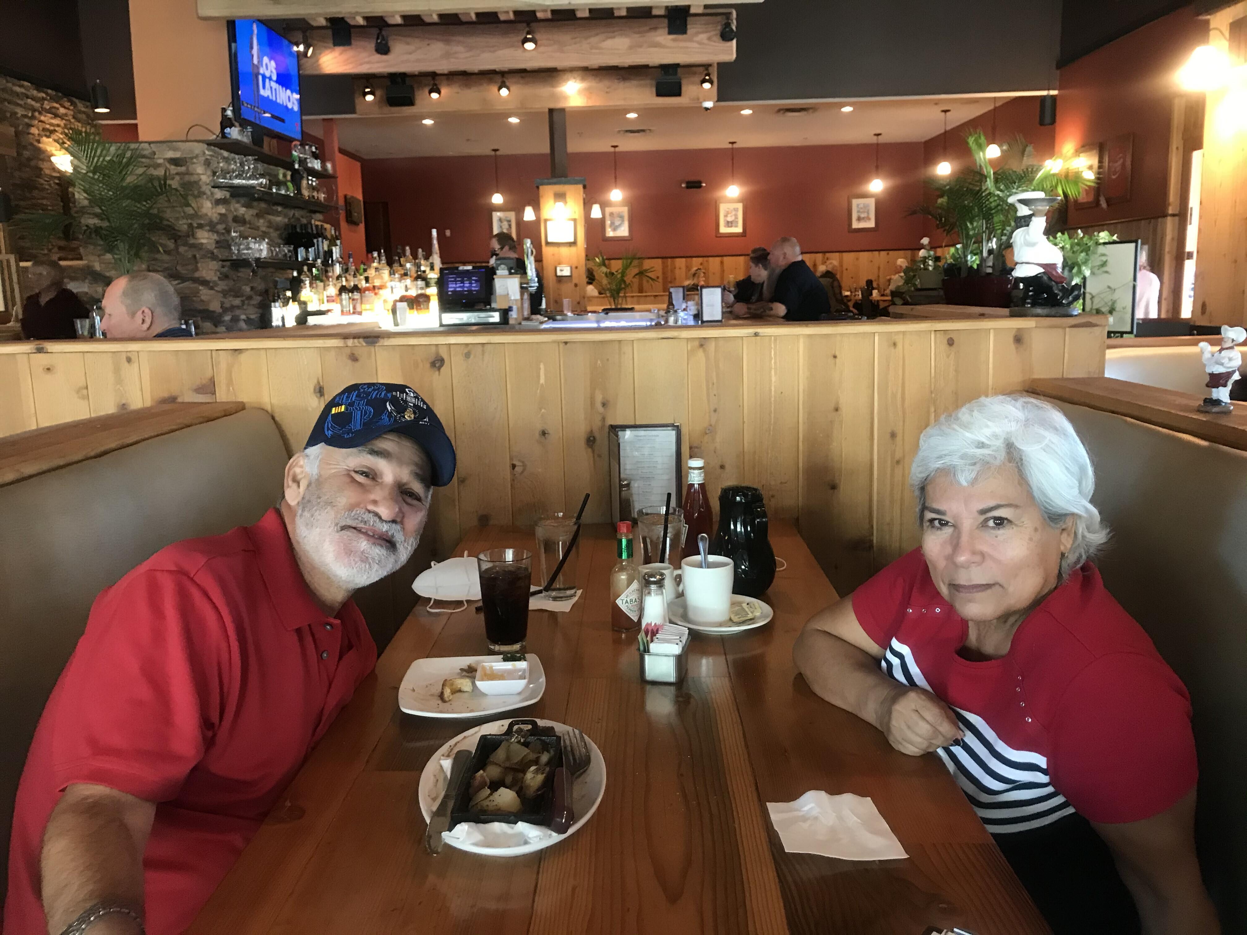 A man and woman sitting at a table