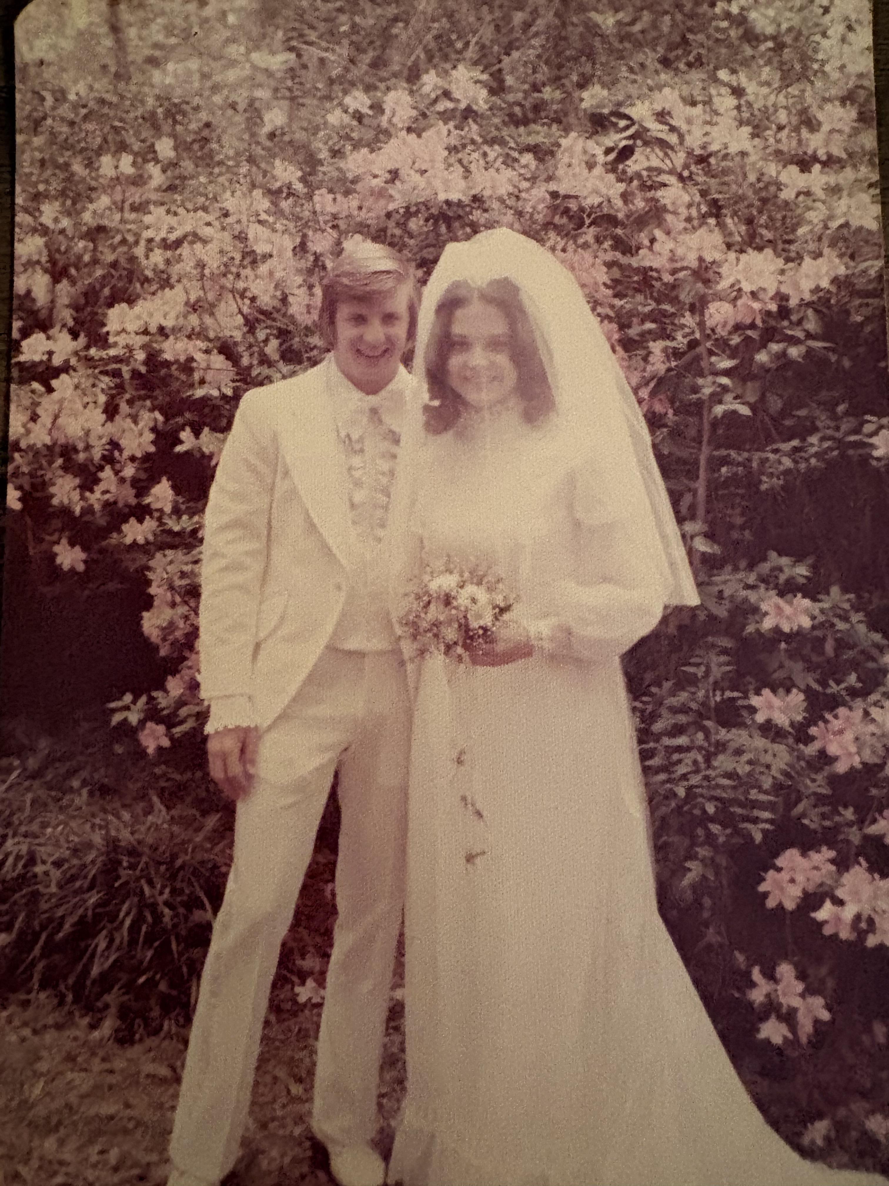 A man and woman in wedding attire