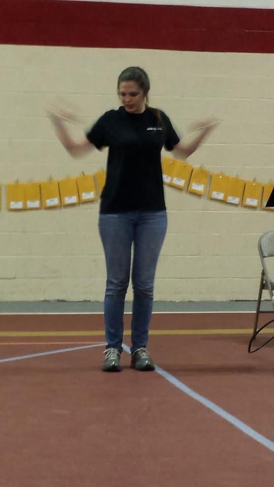 A woman standing on a track