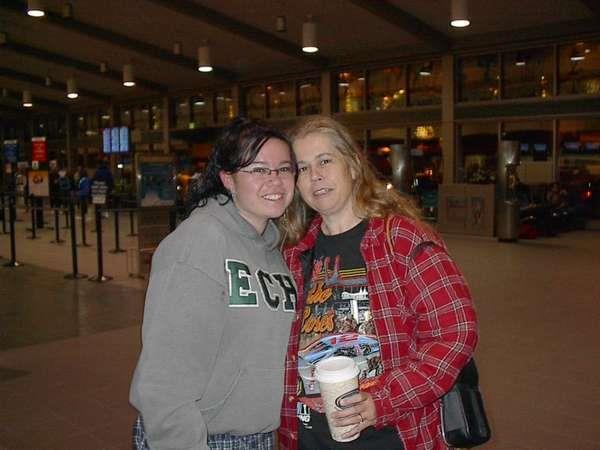A couple of women standing together