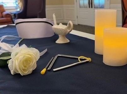 A rose and a triangle on a table