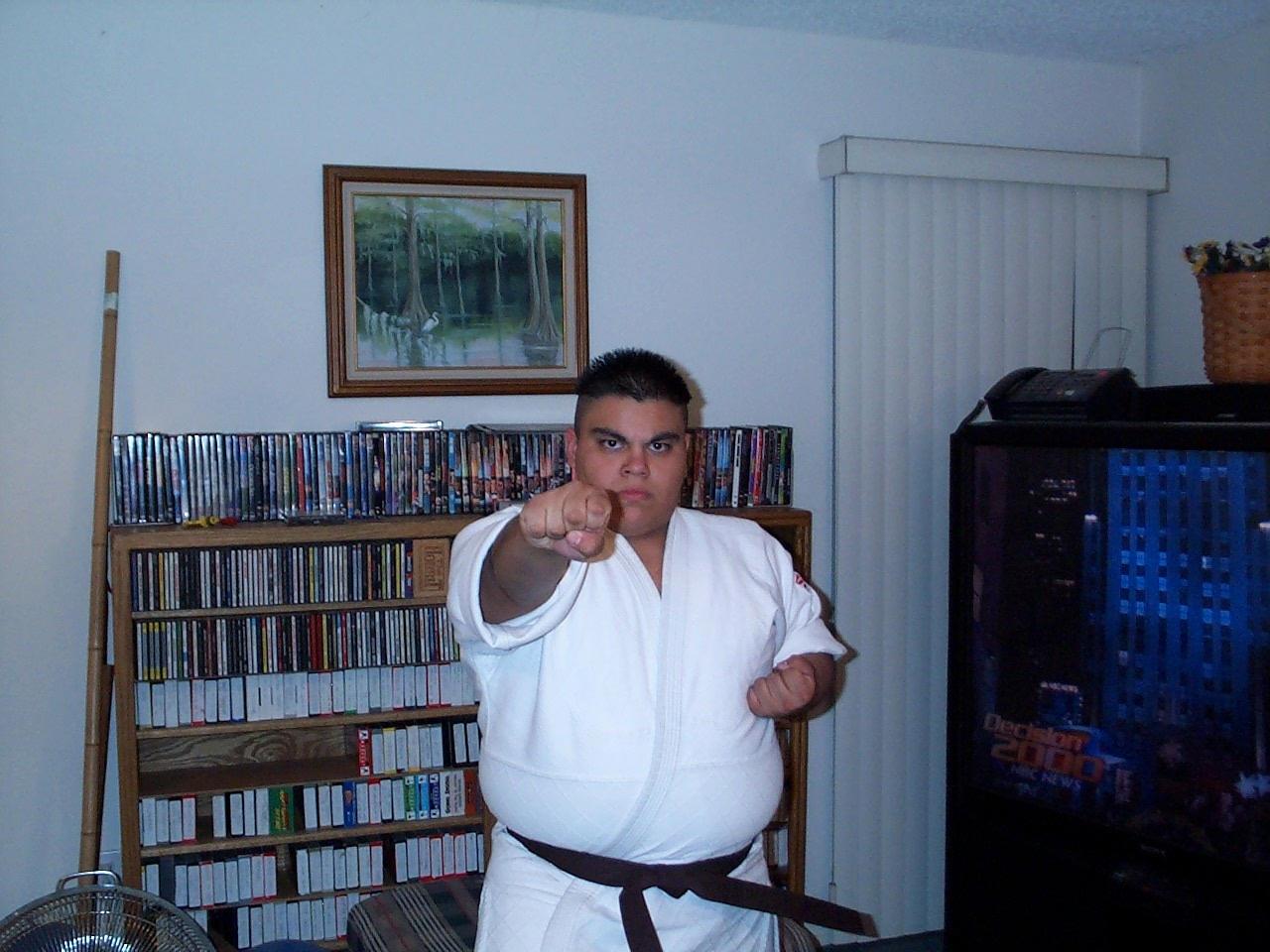 A man in a white robe pointing his finger