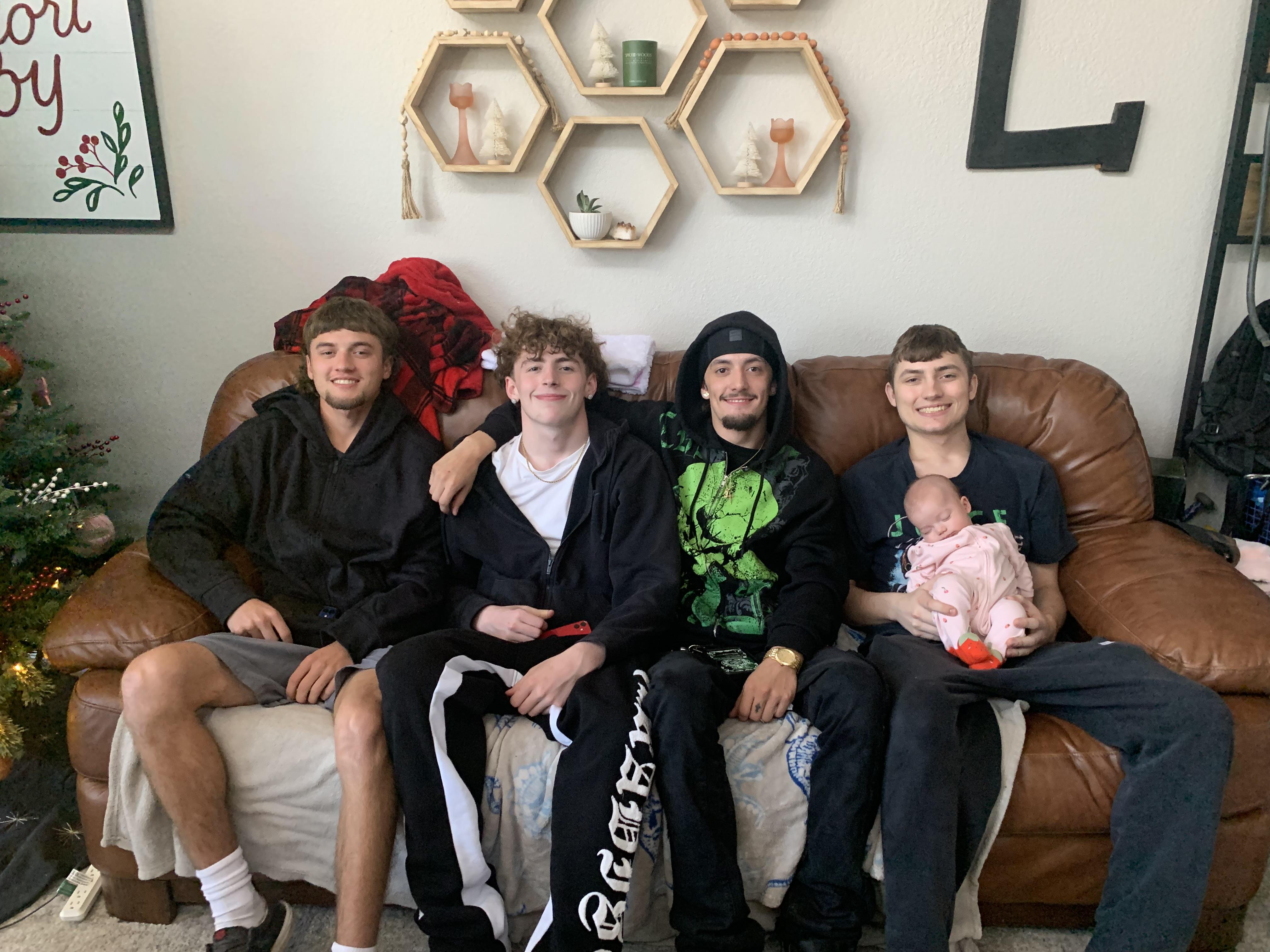 A group of men sitting on a couch