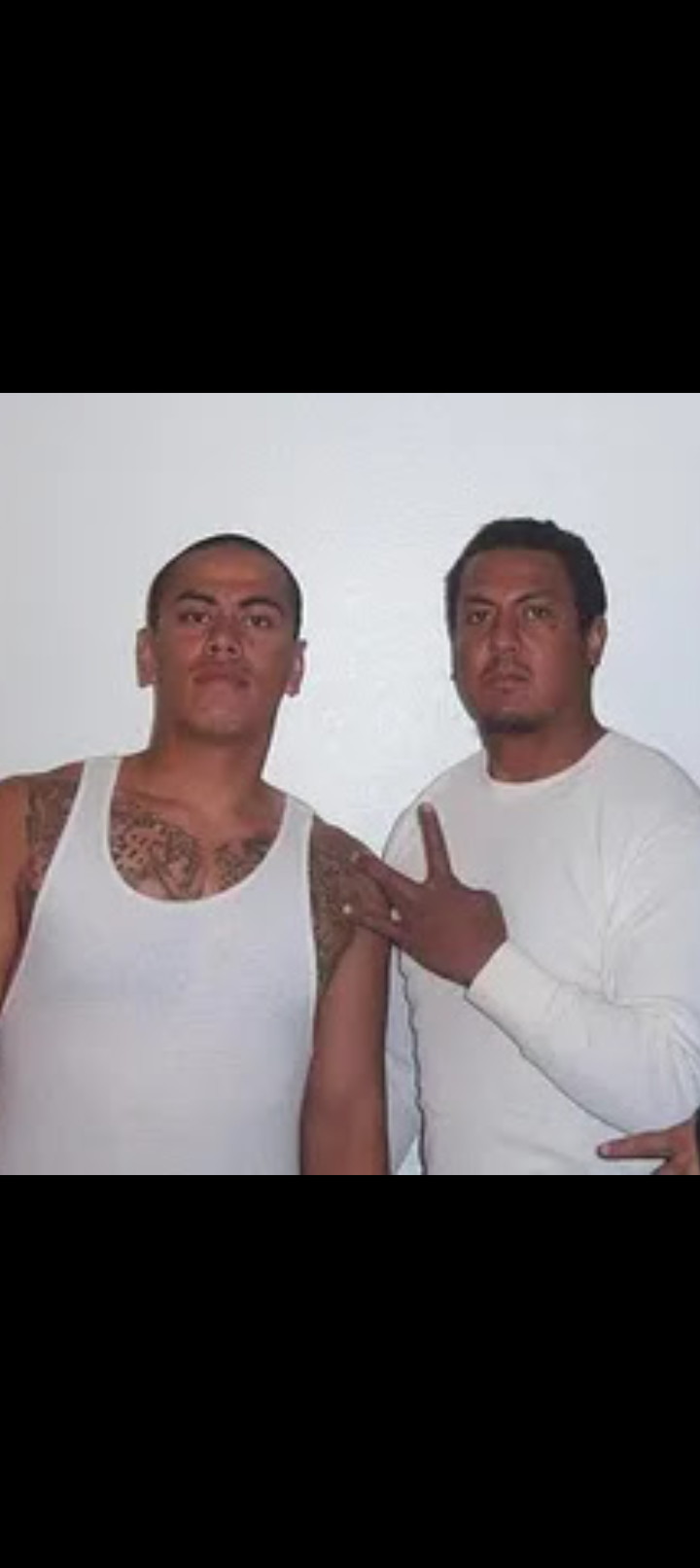 Two men posing for a picture