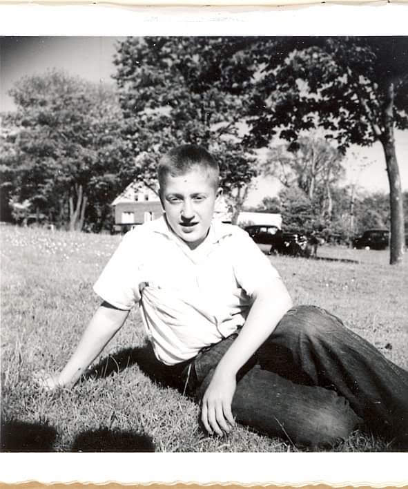A man sitting on grass