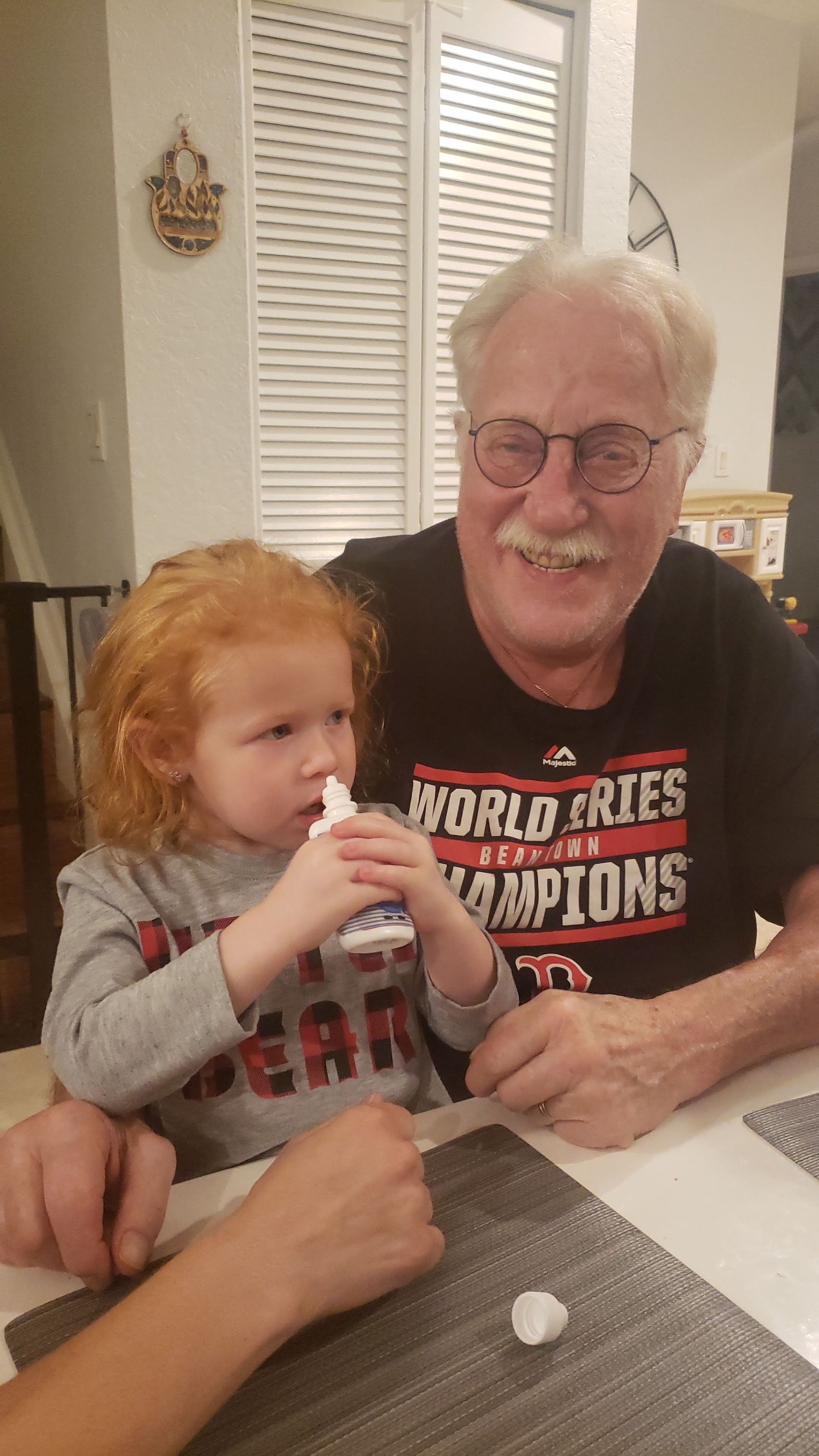 A man and child sitting at a table