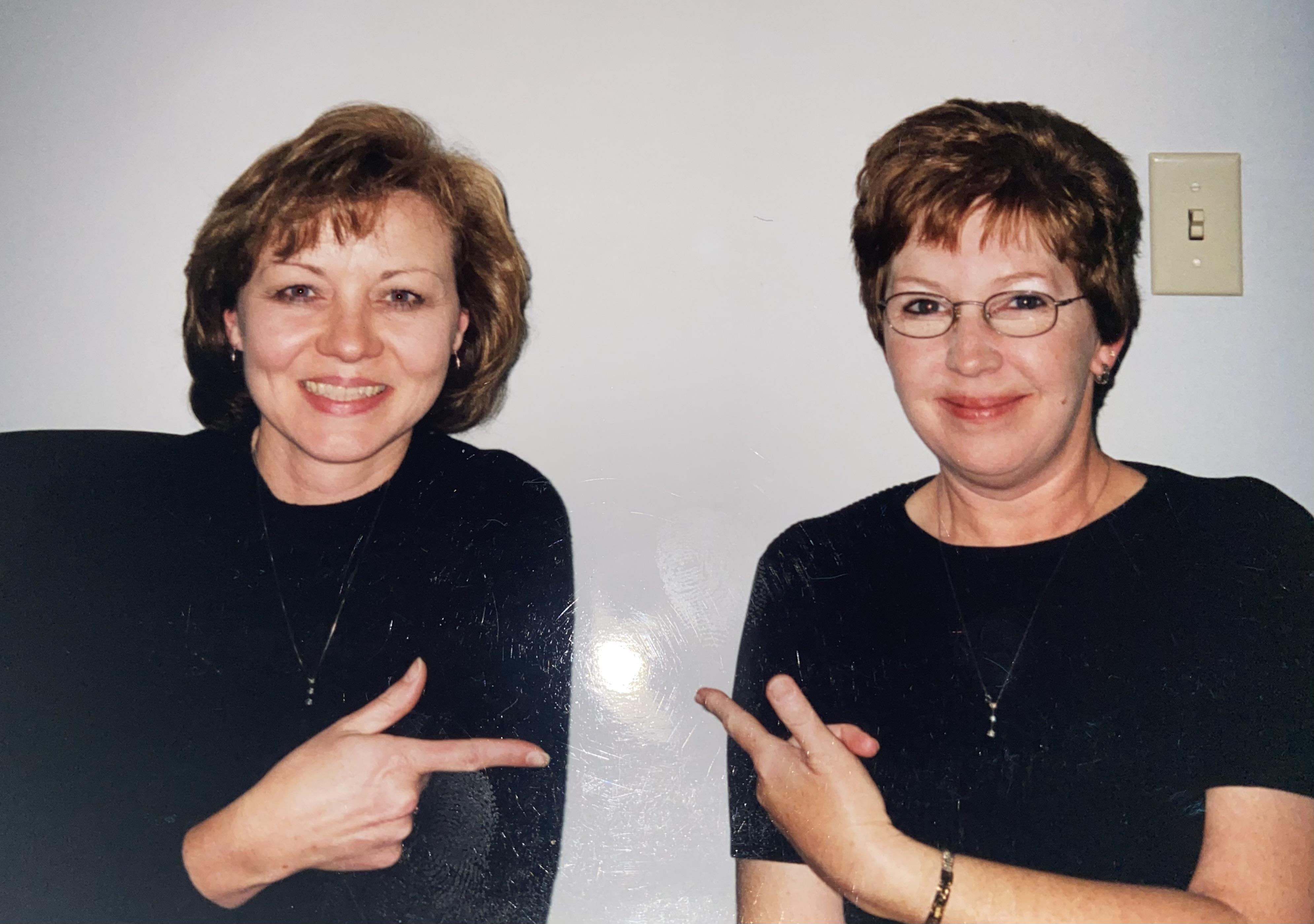A woman pointing at herself