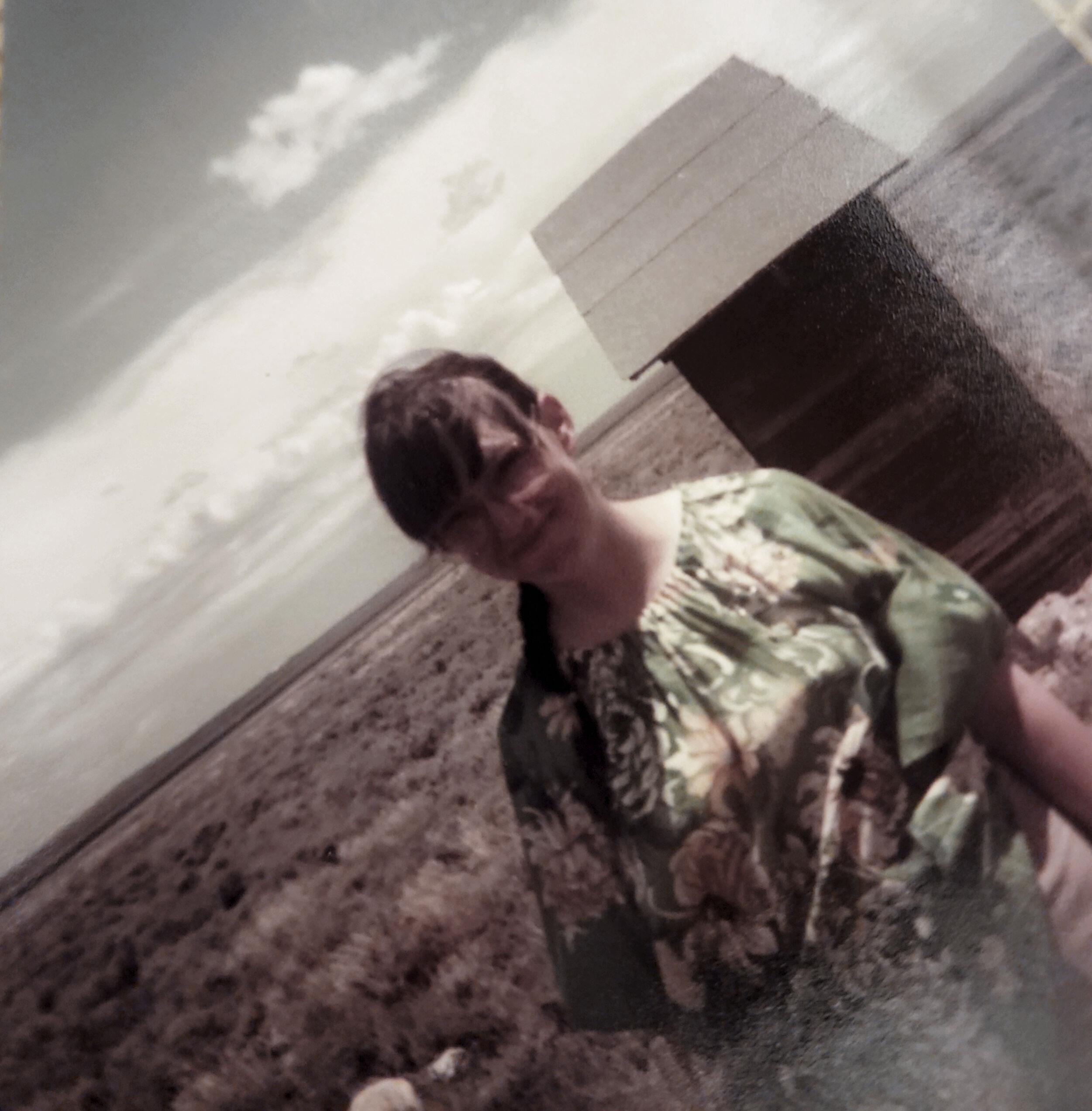 A woman standing in a field